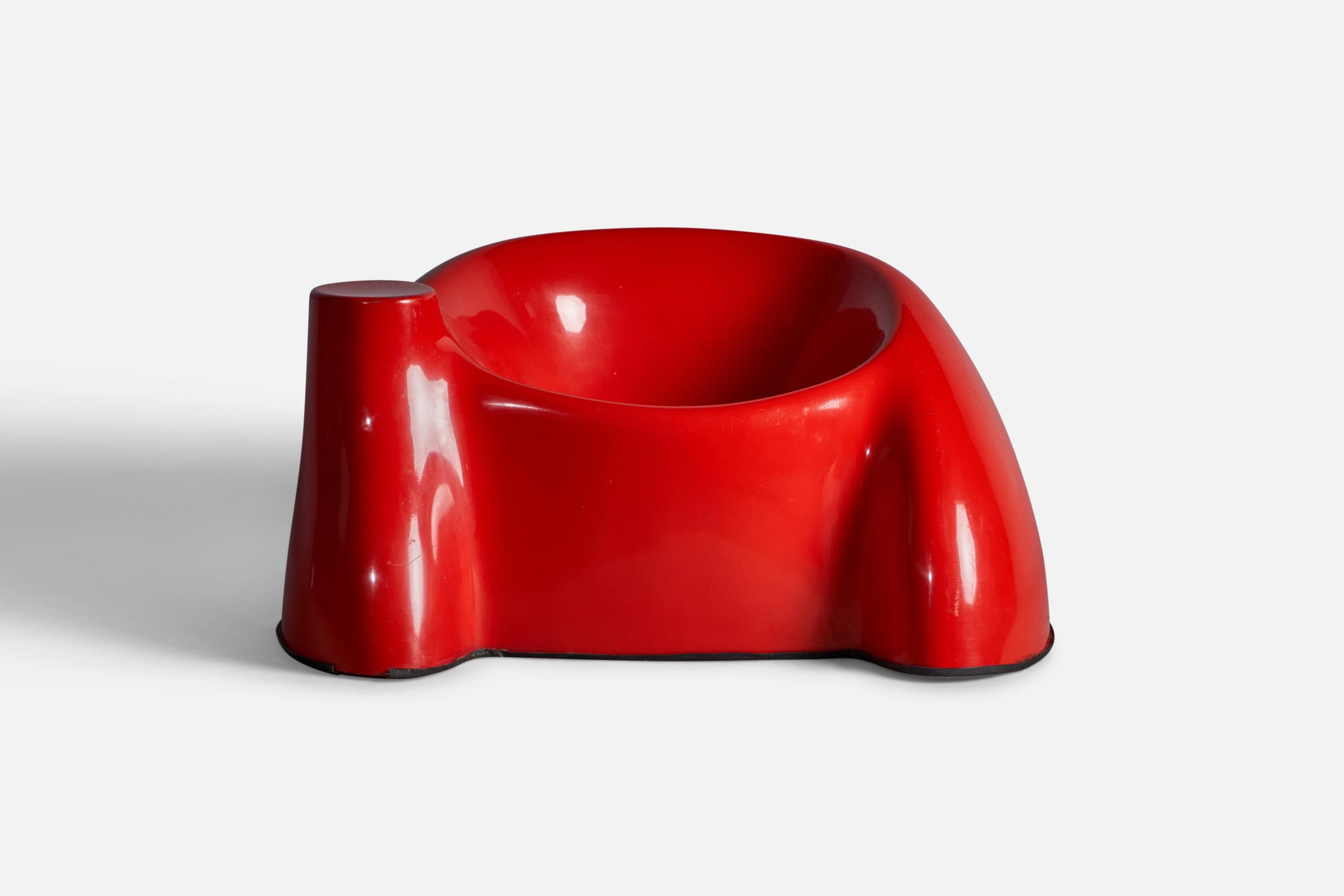 A red-lacquered fiberglass lounge chair, designed and produced by Wendell Castle, USA, 1970s.

14.75