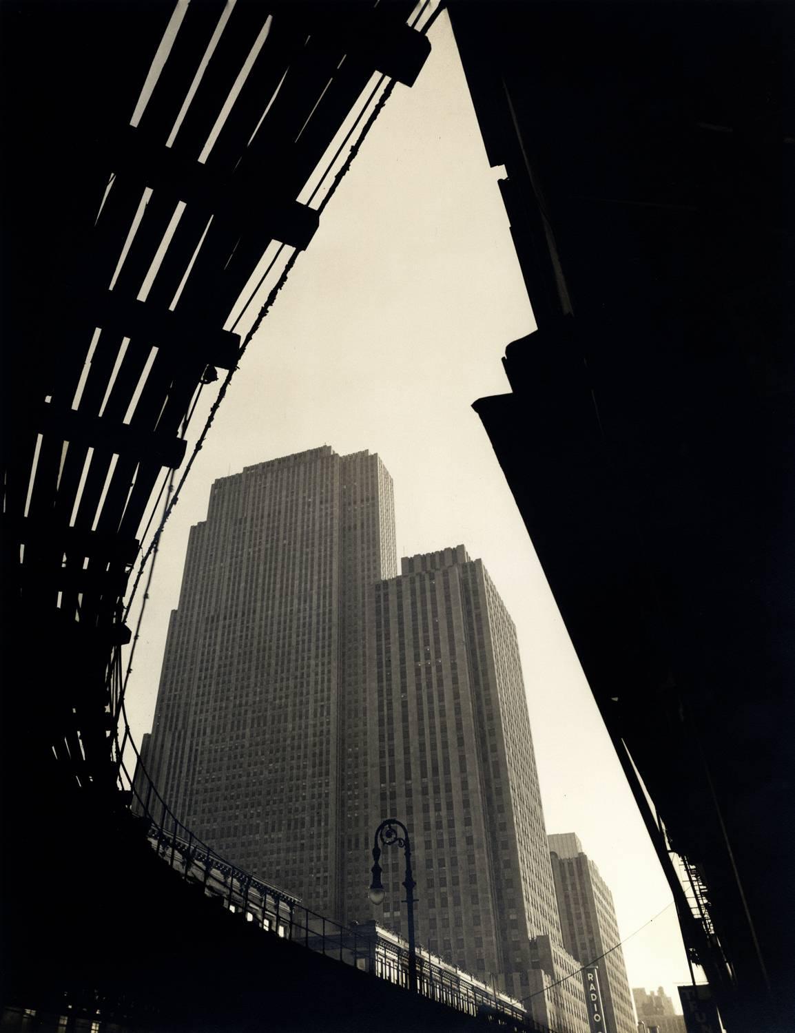 Wendell MacRae Black and White Photograph - Rockefeller Center, Seen from below the Sixth Avenue El
