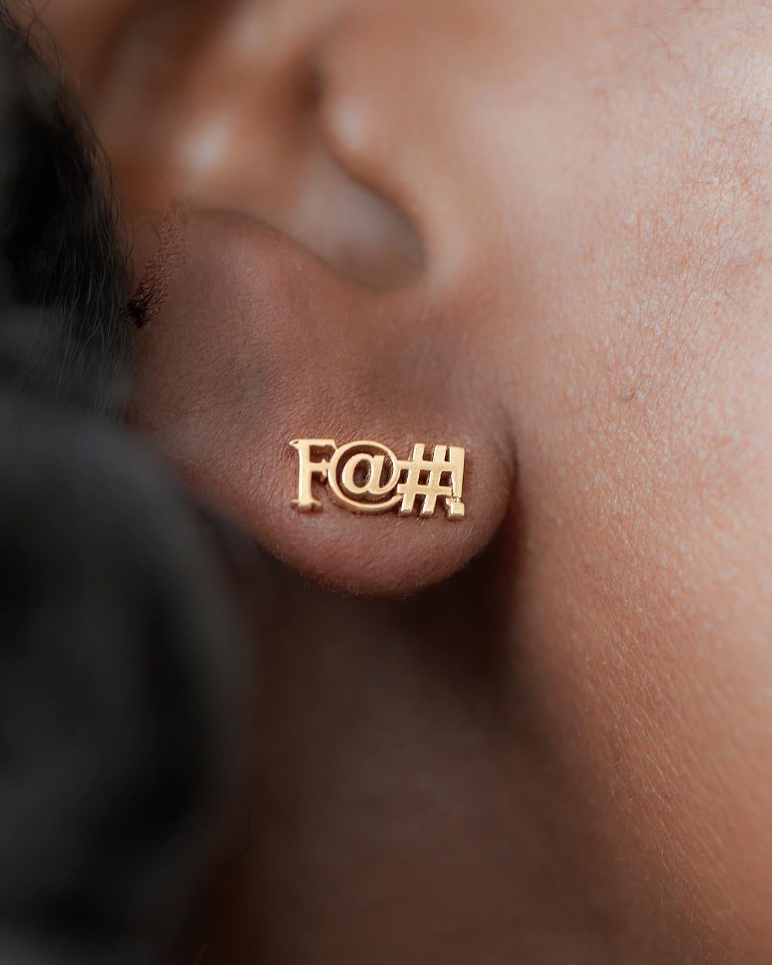 Let your earlobe do the talking with this 18K rose gold stud earring. Tastefully censored so you can wear it in polite company. Sold as a single, rather than a pair, so you don't have to repeat yourself ... but if you want a pair, go ahead and buy
