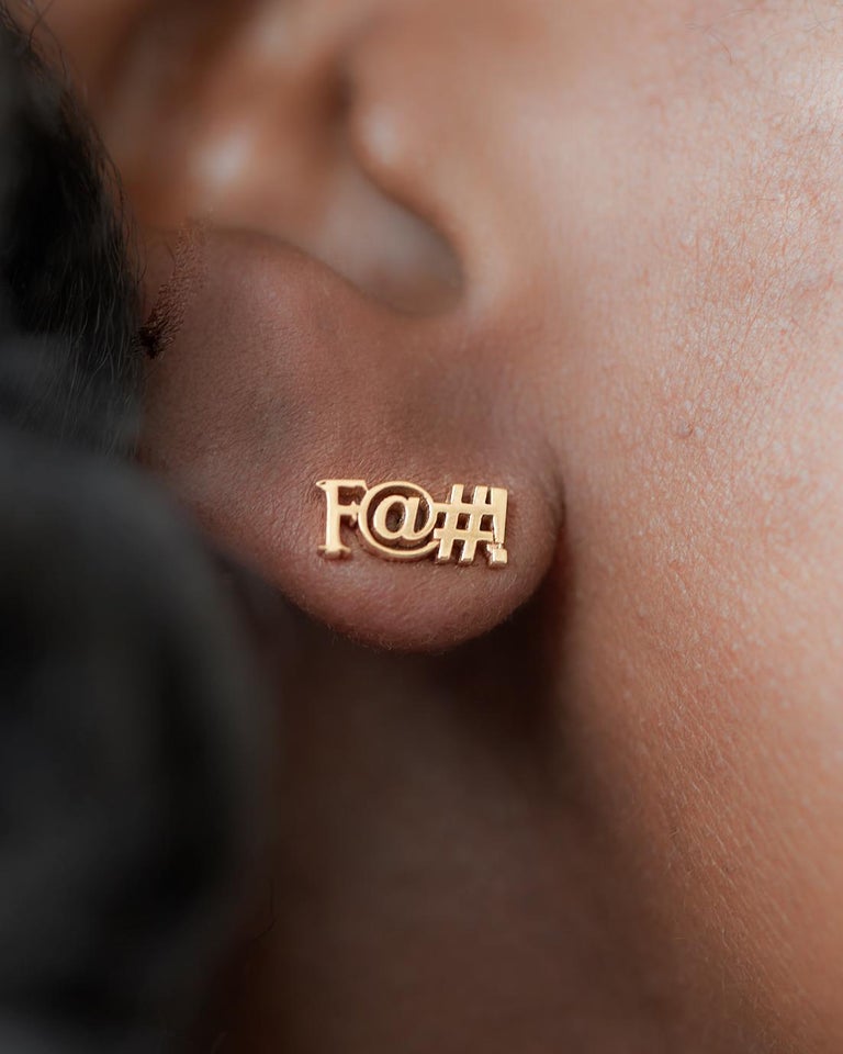 Let your earlobe do the talking with this 18K rose gold stud earring. Tastefully censored so you can wear it in polite company. Sold as a single, rather than a pair, so you don't have to repeat yourself ... but if you want a pair, go ahead and buy