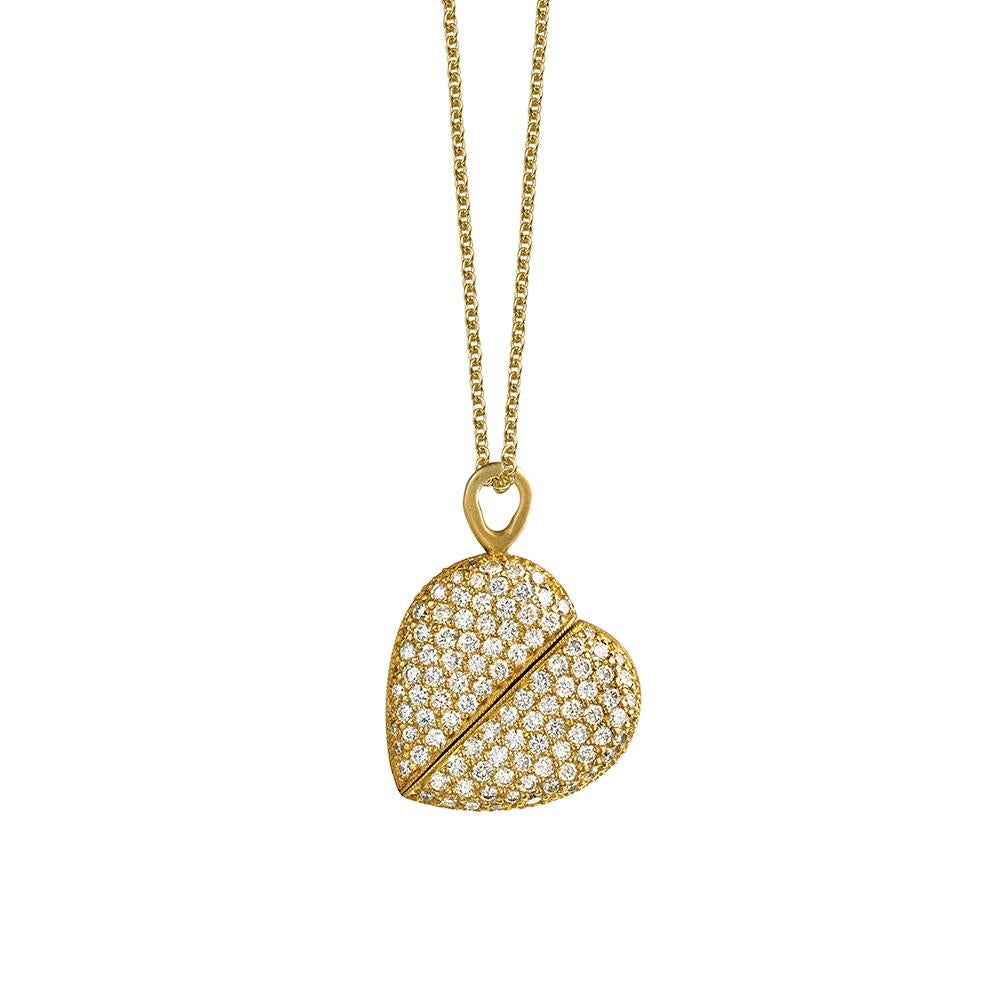 Pendant twists from heart shape to oval and back.
18K yellow gold with satin finish.
1.1 carats of white diamonds.
16