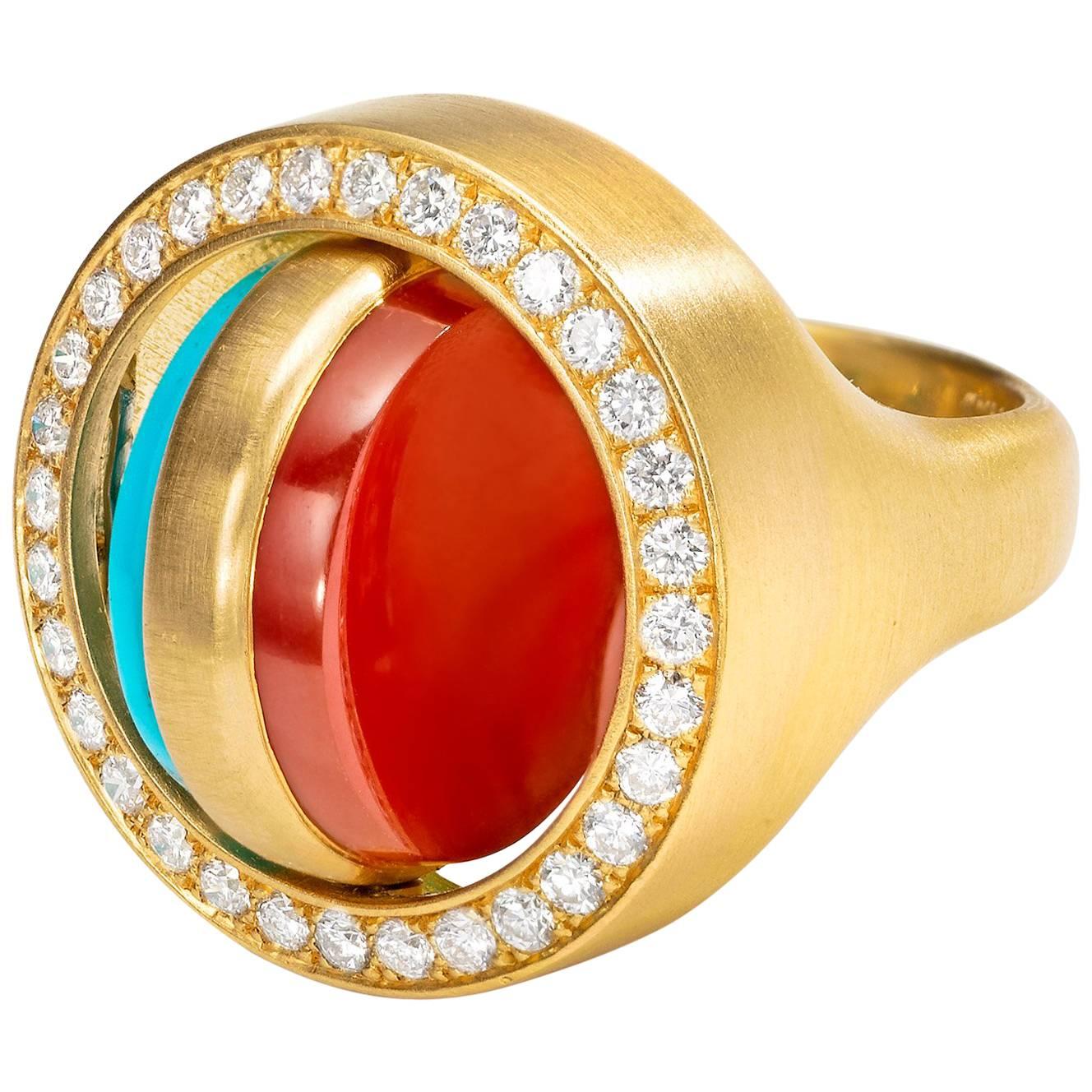 Two one-of-a-kind pieces that are also two-in-one! Wear turquoise or carnelian, depending on your mood. This is a deceptively complicated design with a classic, heirloom look.

RING
Swivel signet-style ring with turquoise center that flips over to