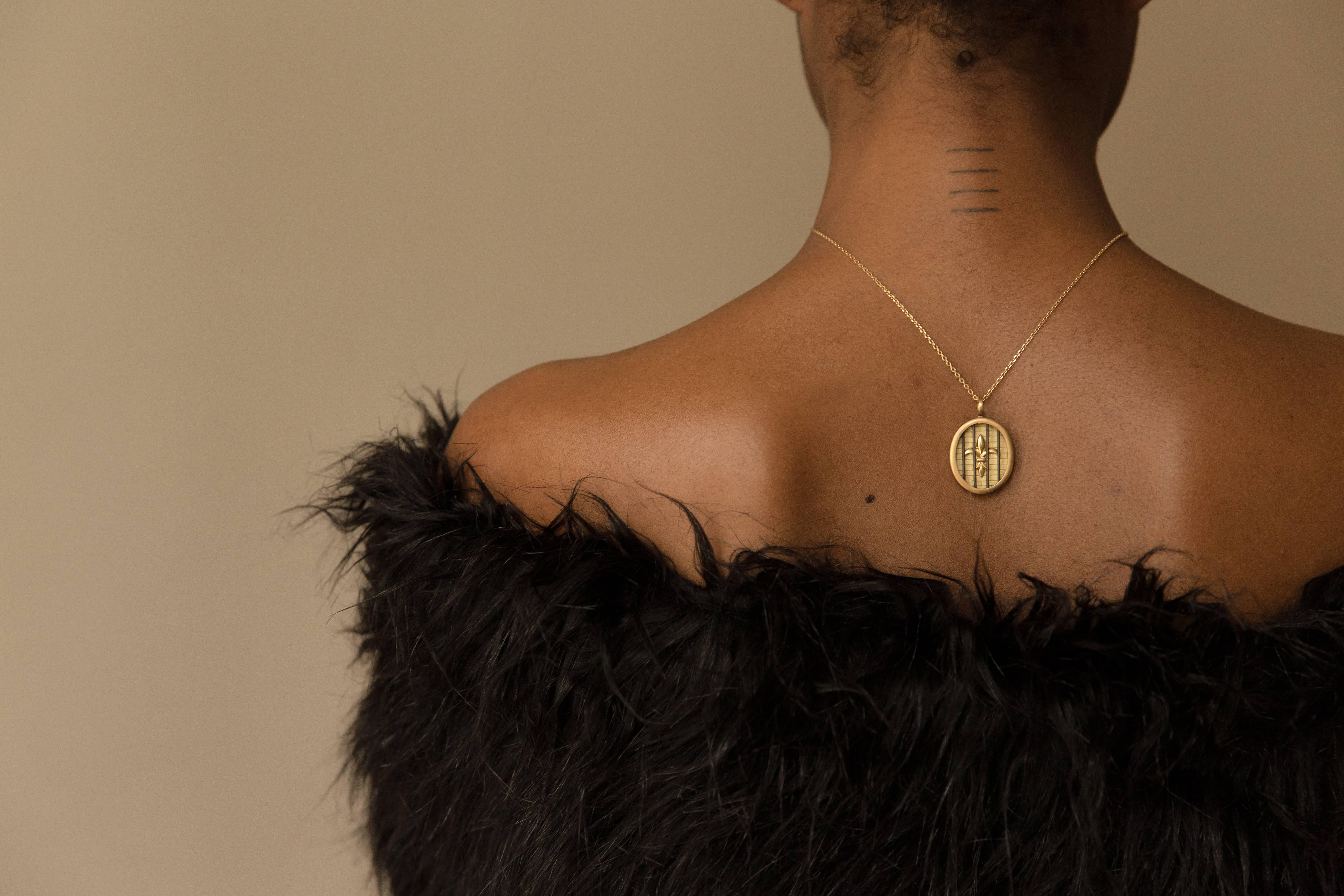 Inspired by Marie Antoinette's daughter, Marie-Thérèse, this chunky 18K oval pendant represents both pain and strength — Marie-Thérèse was imprisoned and mistreated during the French Revolution. She was only 11 when the Bastille was stormed on July