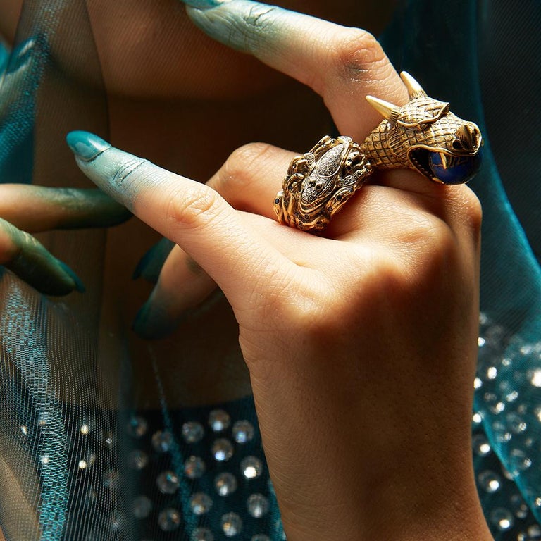 Globe spins in dragon's mouth.
Approx. 25 grams 18K yellow gold, satin finish.
Custom-cut lapis lazuli (globe).
Diamond accents.
Black rhodium detail.
One-of-a-kind.
As seen on supermodel Bella Hadid for Paper Magazine.

This exceptional ring was