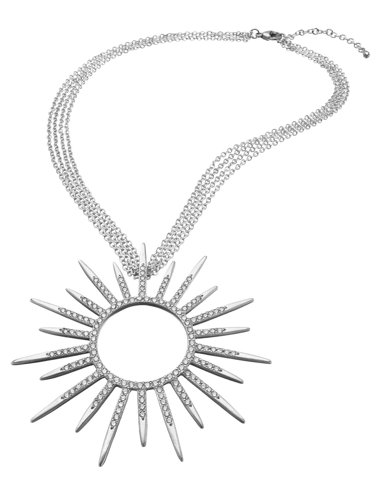 Like many of Wendy's designs, this sunburst pendant was inspired by a powerful woman -- the Tudor dynasty's Queen Elizabeth I.  Elizabeth I carefully crafted a supernatural, deity-like image of herself through portraits, jewelry, dress, and