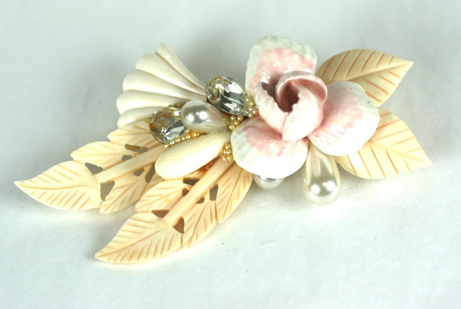 Large Wendy Gell jeweled Dresden porcelain and hand carved shell floral brooch from the 1980's. Wendy Gell hot glue gunned her way to fame by assembling fantastical and charming pastiches of found objects mixed with Swarovski crystals. Very over the