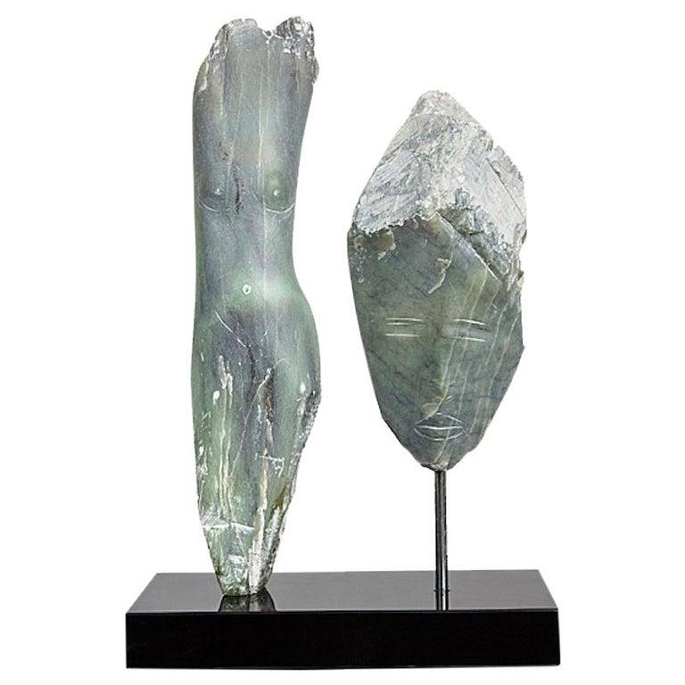 Contemporary American sculptor Wendy Hendelman's Green Alabaster Head and Torso Sculpture on black marble base. Hendelman’s work reflects her love of the primitive and the ancient. The small scale and style have established her identity as a