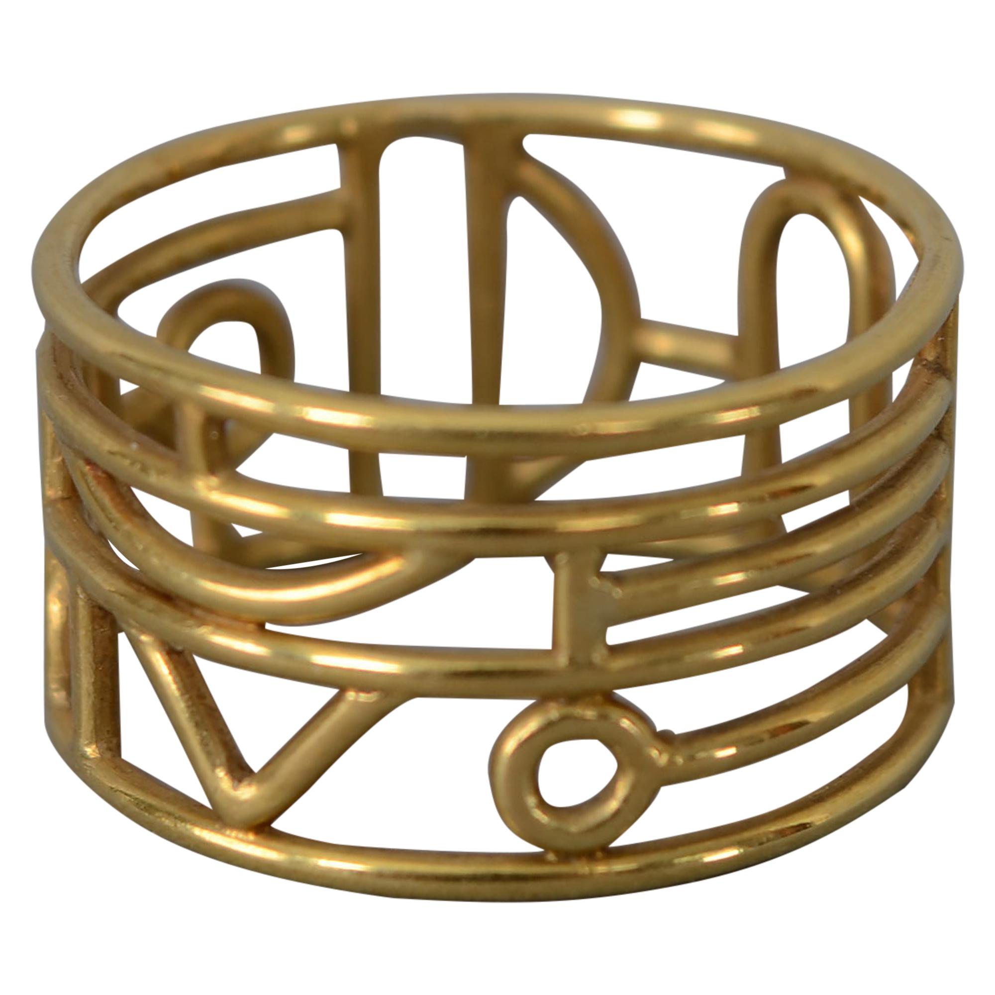 Wendy Ramshaw Gold Band Ring on Lucite Stand