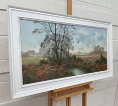 Peinture à l'huile d'un artiste britannique du 20e siècle représentant des faisans dans la campagne anglaise