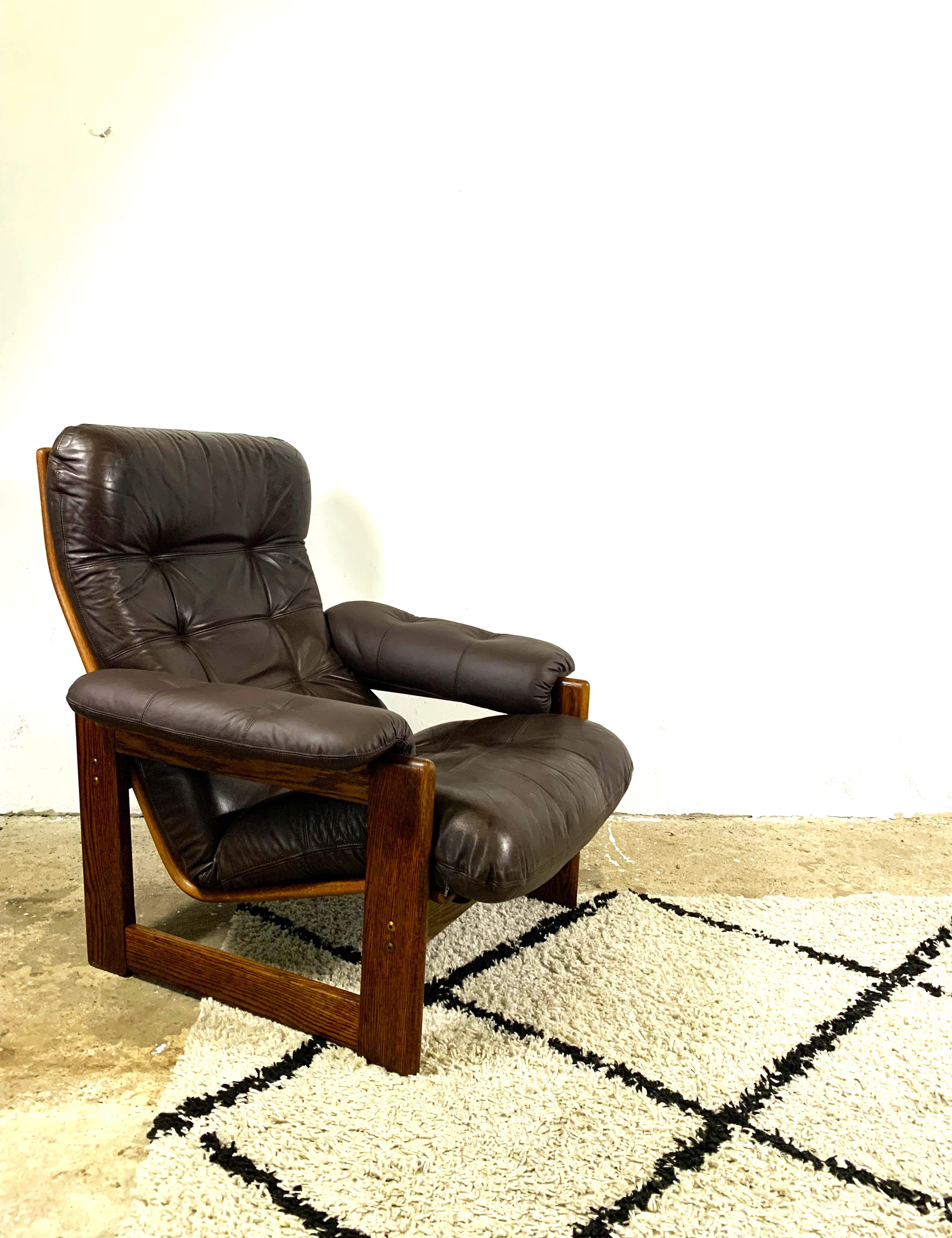 Leather wenge armchair made by Dutch Coja furniture makers, stunning chair, lovely organic shape, leather has lovely patina. Armrest parts are reupholstered with similar leather. Very comfortable. Stylish!