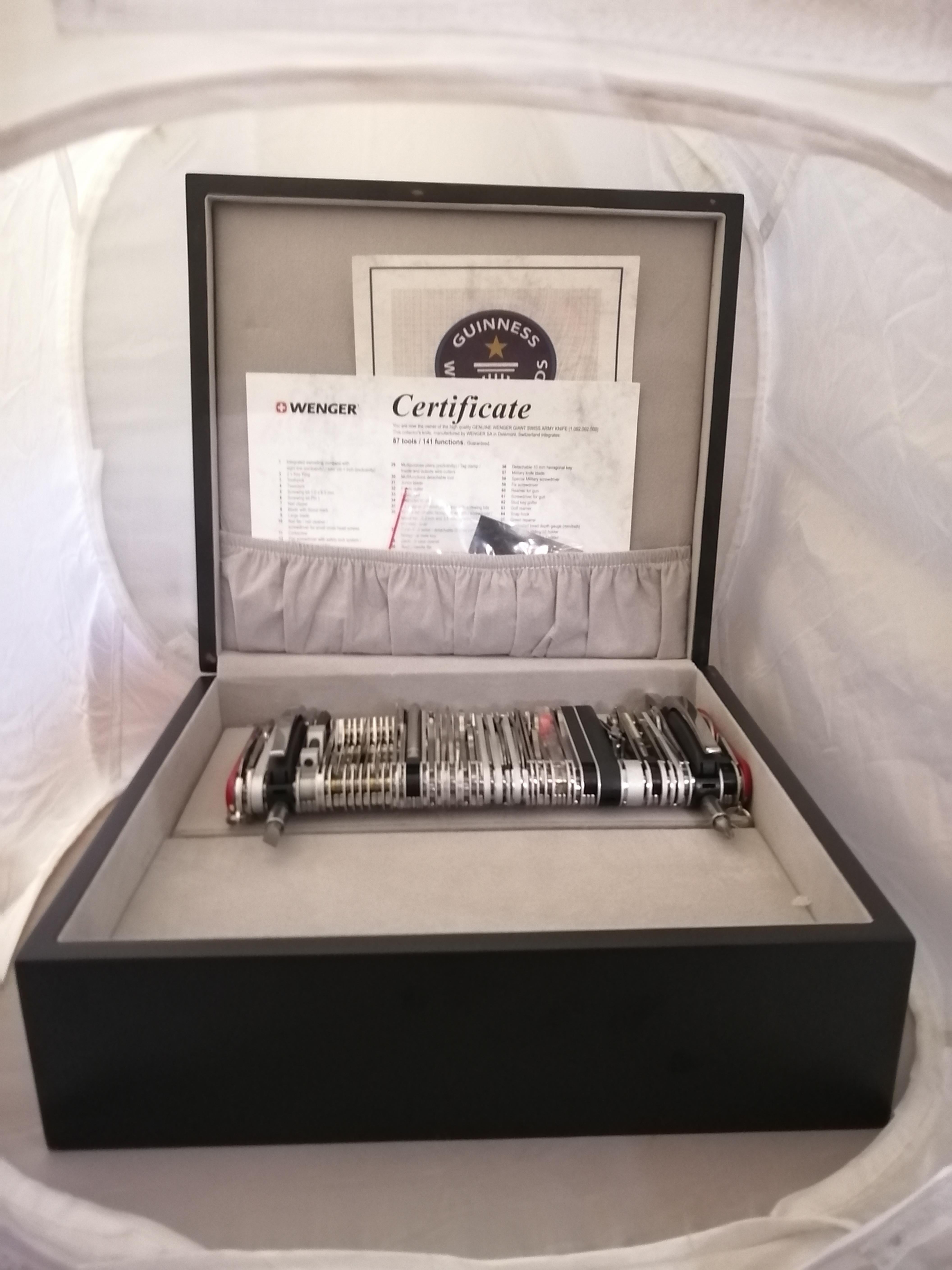 A Wenger SA Giant Swiss Army 16999 giant knife 2007 manufactured in Délemont, Switzerland. This Guinness world record Swiss knife contains 87 tools that can be used for 141 different functions. It includes 2 certificates, a warranty certificate a