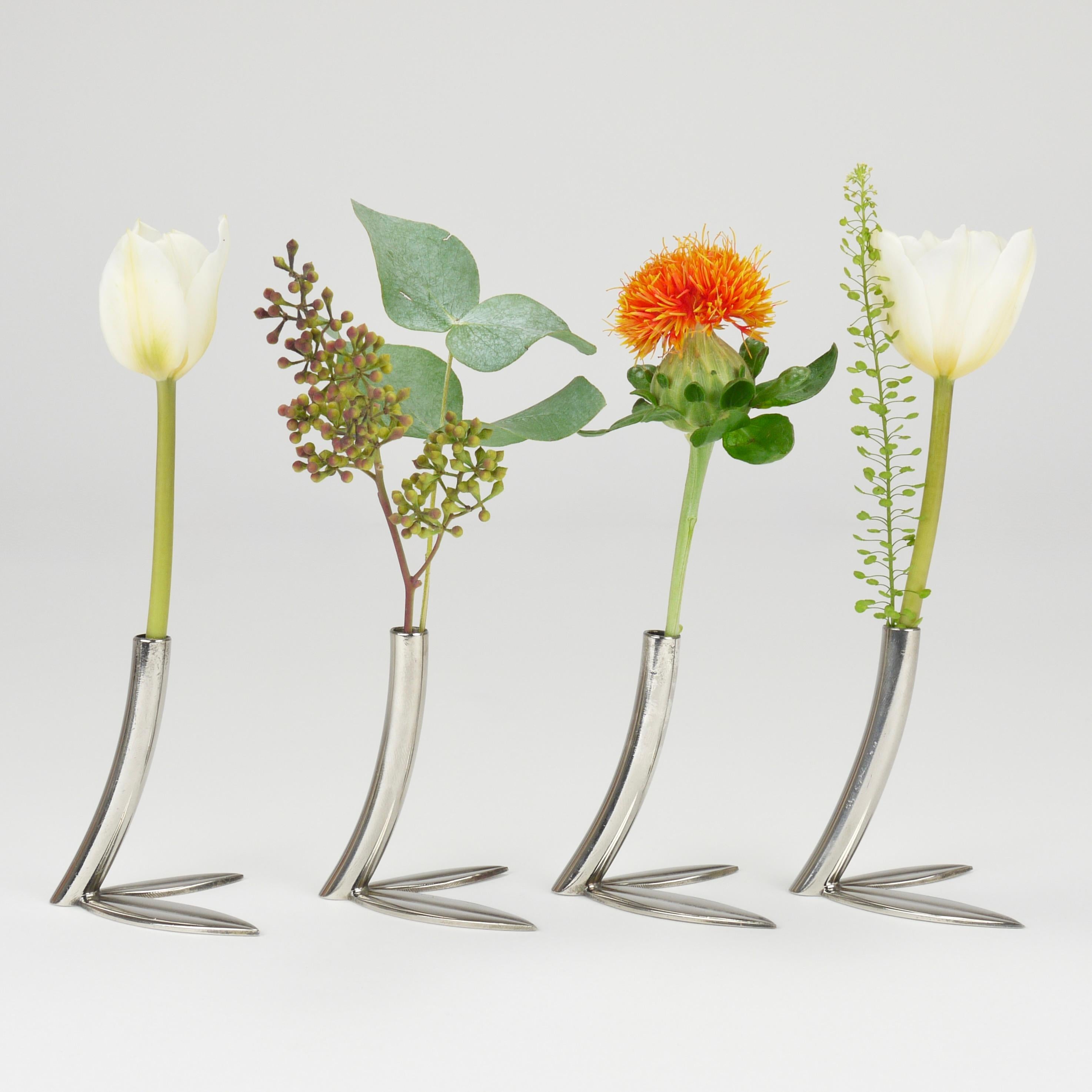 Up to six truly delightful Solifleur single-stem vases from the 1960s, sold and priced per pieces, manufactured by Workshop Hagenauer, Vienna, Austria. The design of these decorative objects dates back to 1932 and they were originally conceived as