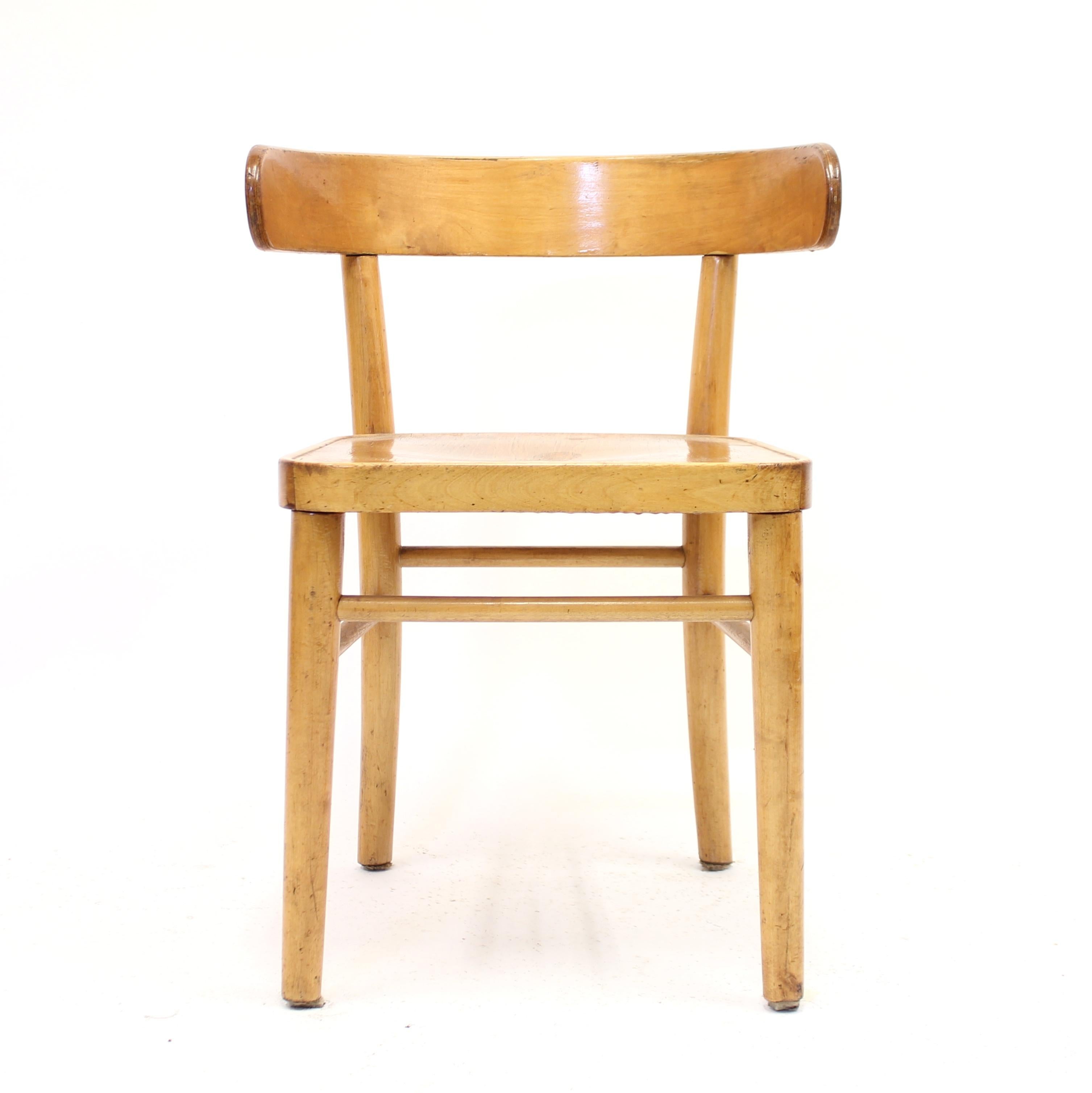 A so called Hugging chair designed by Finish designer Werner West in the 1940s and manufactured by Wilhelm Schauman in the town Jyväskyle in the middle of Finland. The design of the back is heavily inspired by the Greek Klismos chairs. The frame is