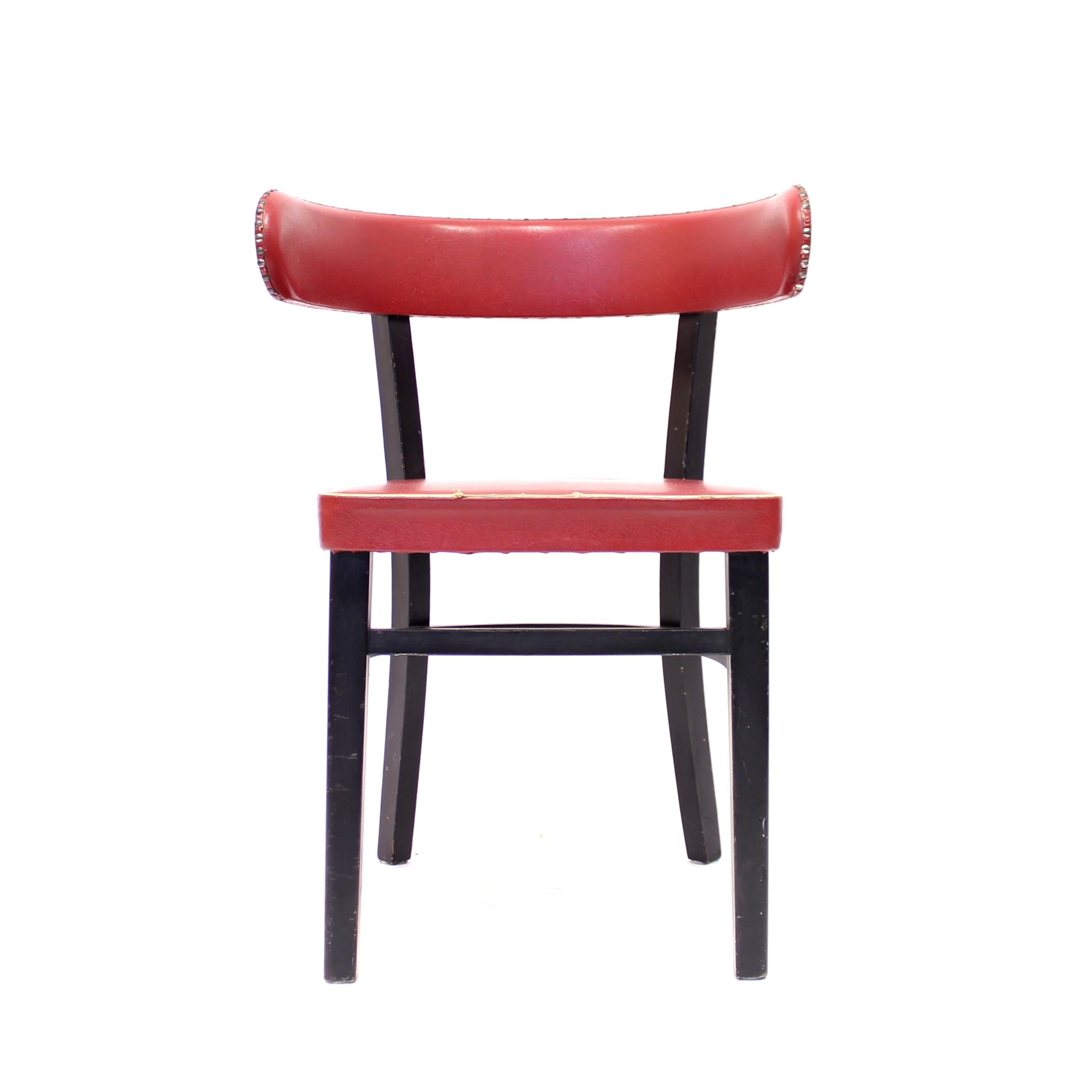 A so called hugging chair designed by Finish designer Werner West in the 1940s and manufactured by Wilhelm Schauman in the town Jyväskyle in the middle of Finland. The design of the back is heavily inspired by the Greek Klismos chairs. The frame is