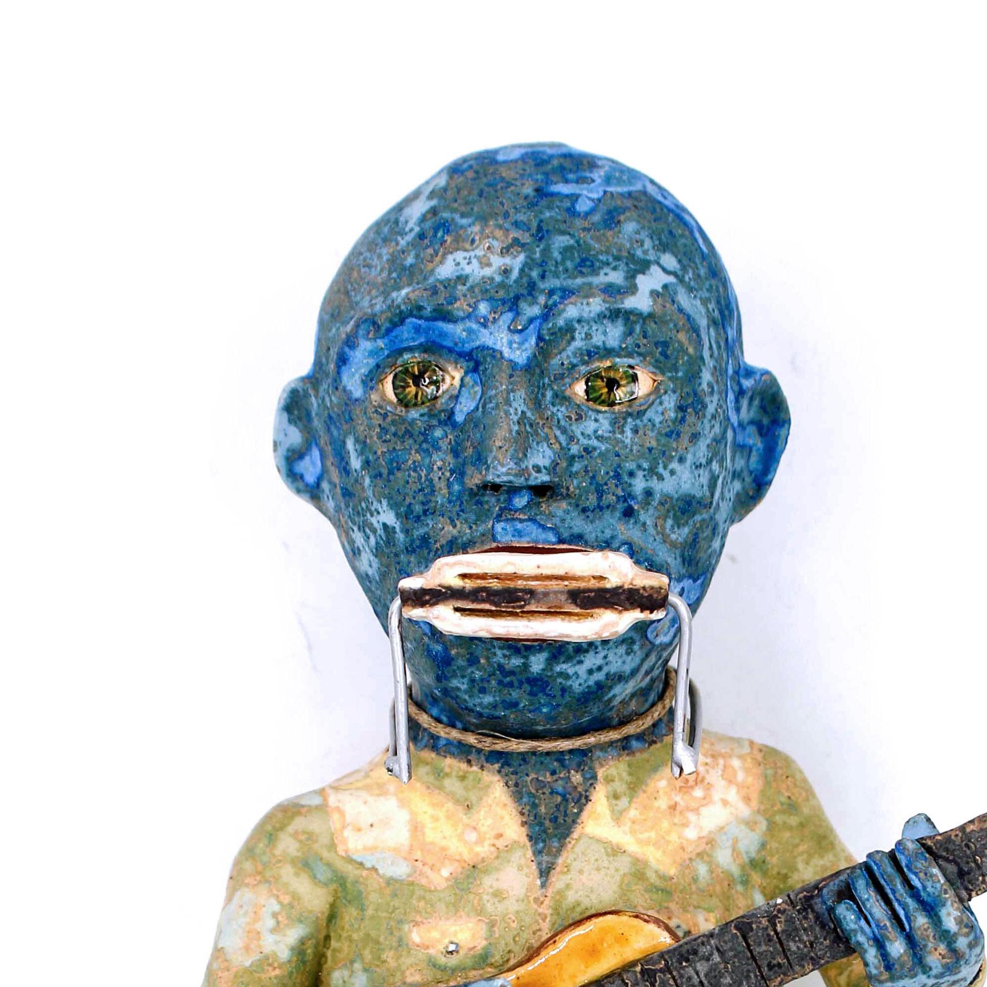 Blues Man is a 2018 ceramic earthenware scultpure by Wesley Anderegg. Blues Man is stamped by the artist with their initials.