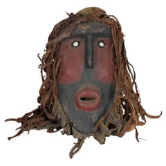 West African Mask from the Dan Tradition with Raffia and Pigmented Surface