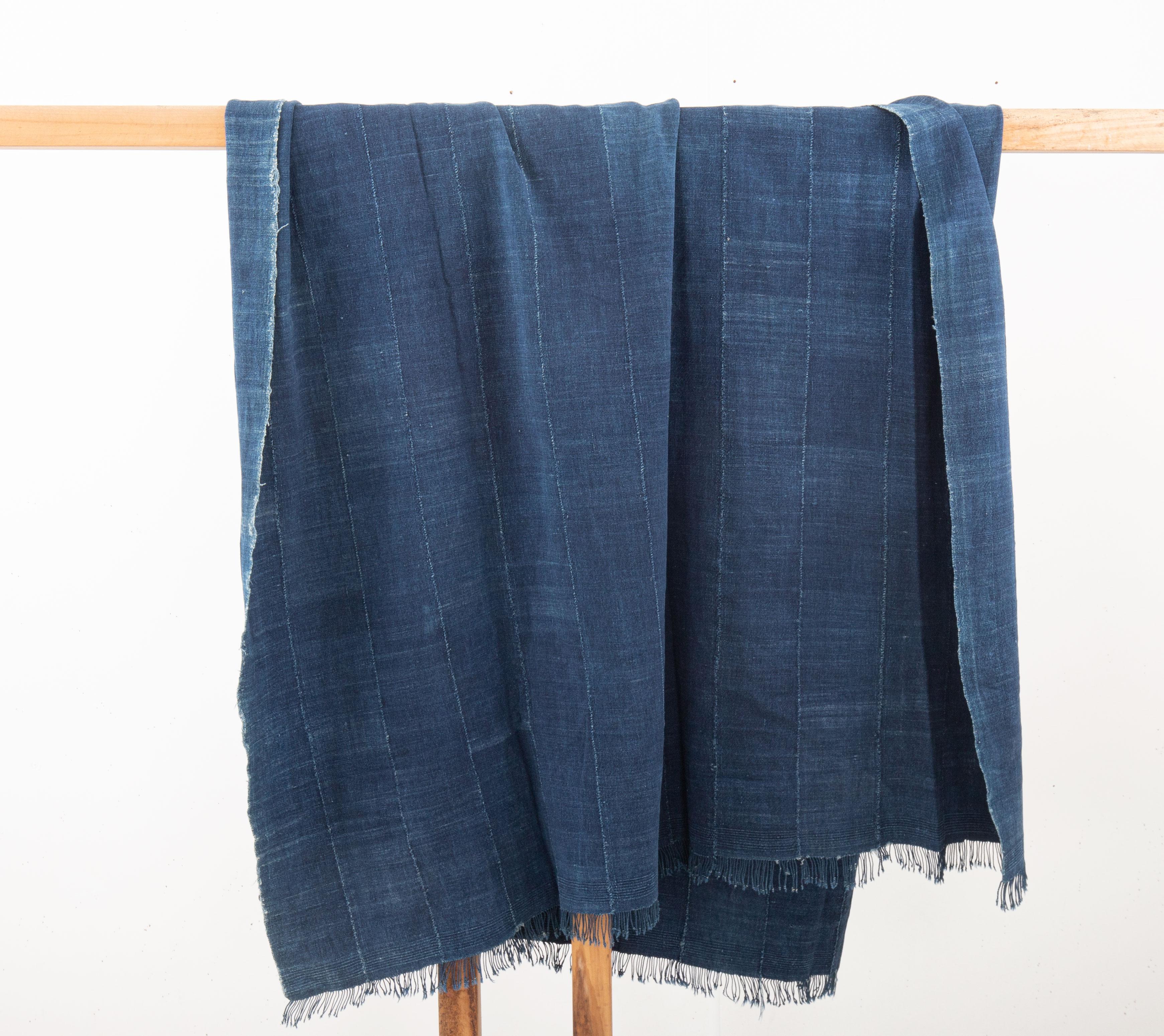 Mali indigo cloth refers to the traditional textiles produced in Mali, West Africa, using indigo dye. These fabrics are an integral part of Mali's rich cultural heritage and have gained international recognition for their distinctive blue hue and