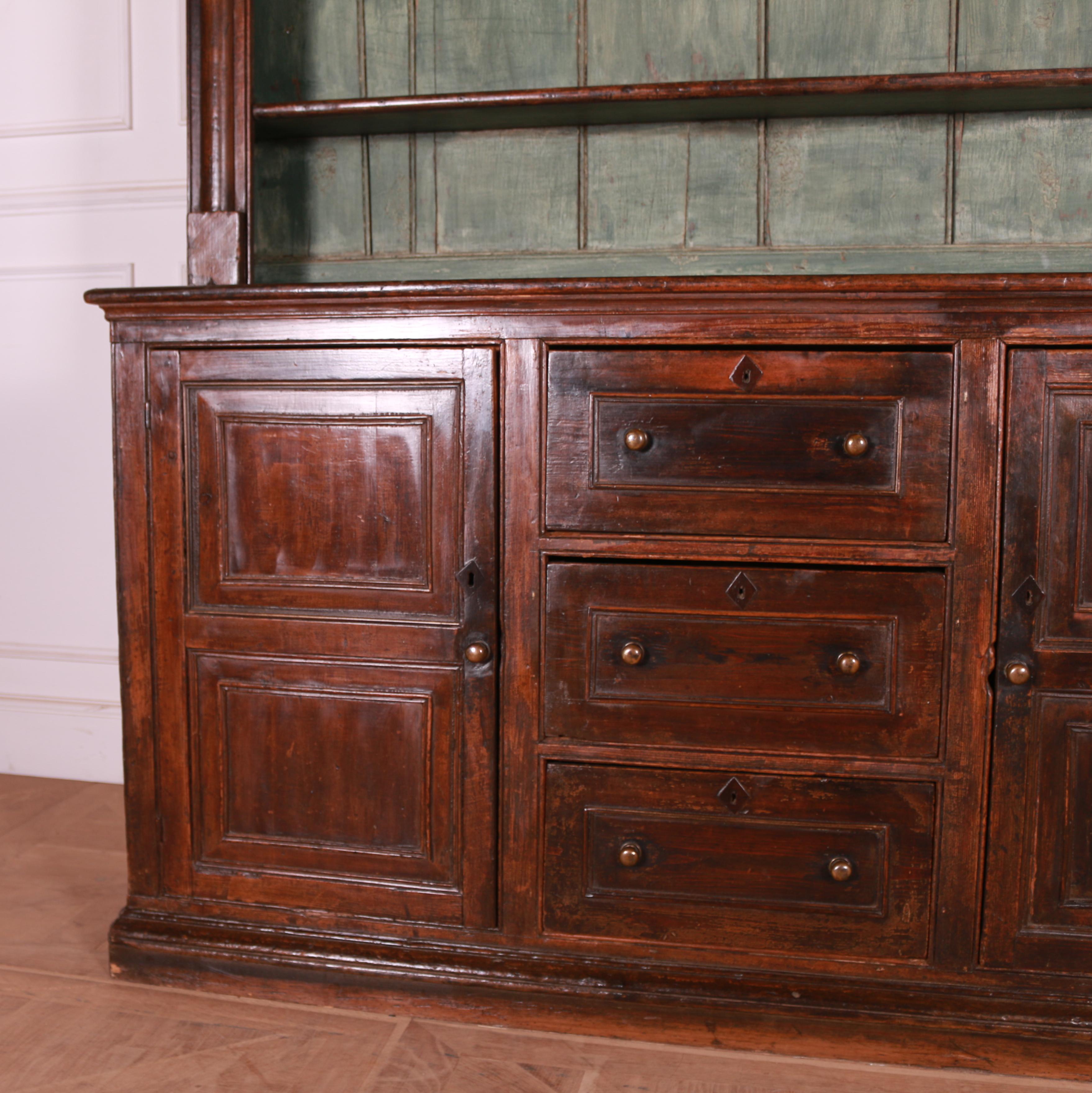 Good early 19th Century west country original painted pine dresser. Wax scumble finish with lovely wear. 1820.

Reference: 7729

Dimensions
72.5 inches (184 cms) wide.
18 inches (46 cms) deep.
79 inches (201 cms) high.