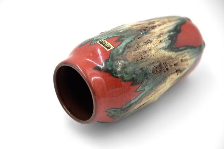 This vase 242-22 was produced in the 1960s in West Germany by the Scheurich. This vase is made of ceramics using the fat lava technique. Partially covered characteristic network of cracks resulting from accidental defects, aging of the glaze or an