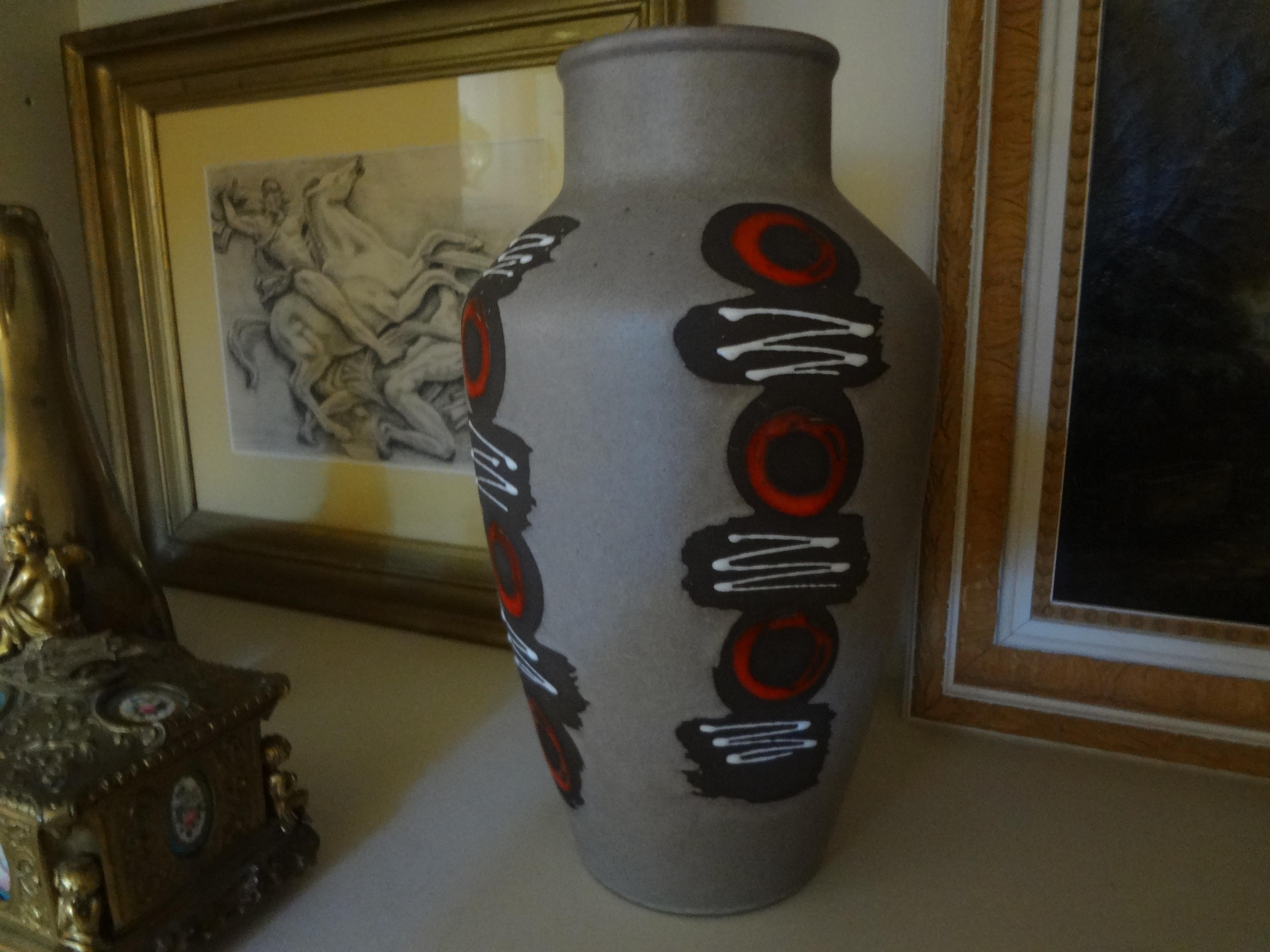 West German glazed pottery vase.
Stunning Mid-Century Modern West German glazed pottery vase with a great abstract decoration.