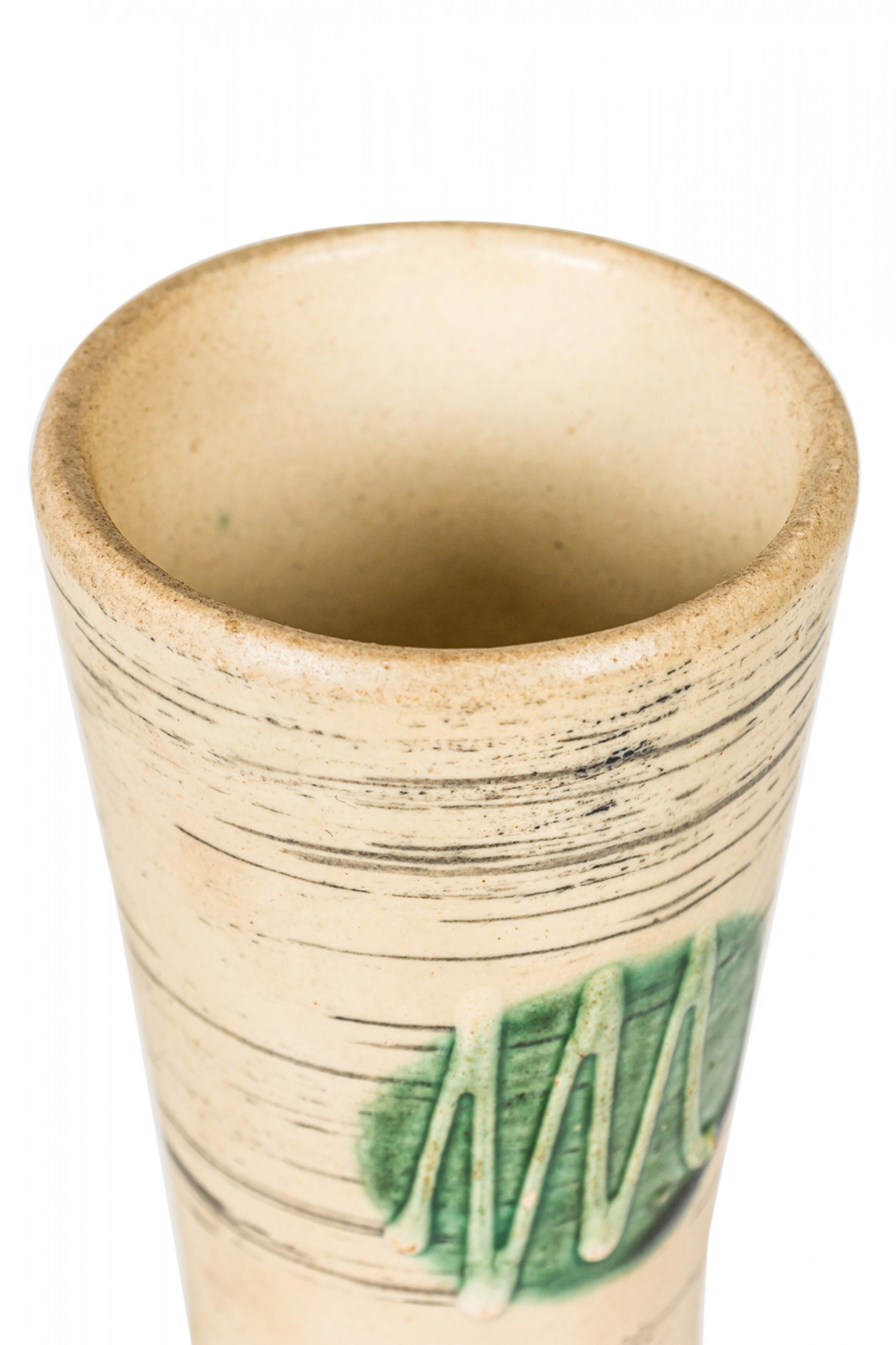 West German Mid-Century hourglass-form ceramic vase with organic thin horizontal black lines interspersed with large green circles centering raised zig zag designs against a beige glazed ground. (mark on bottom, W. GERMANY 654-25).