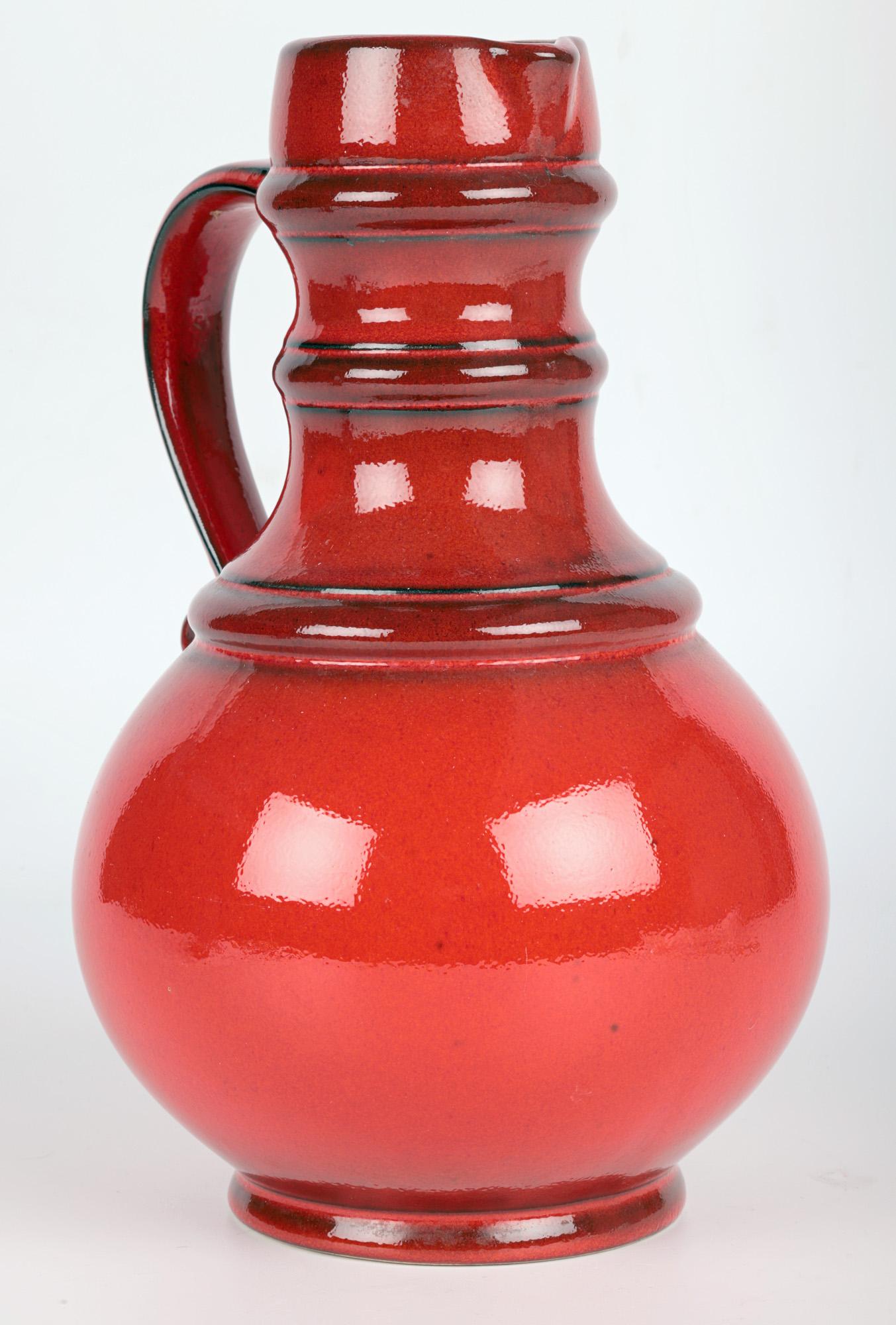 Ceramic West German Mid-Century Pottery Red Lava Glazed Pitcher Vase For Sale