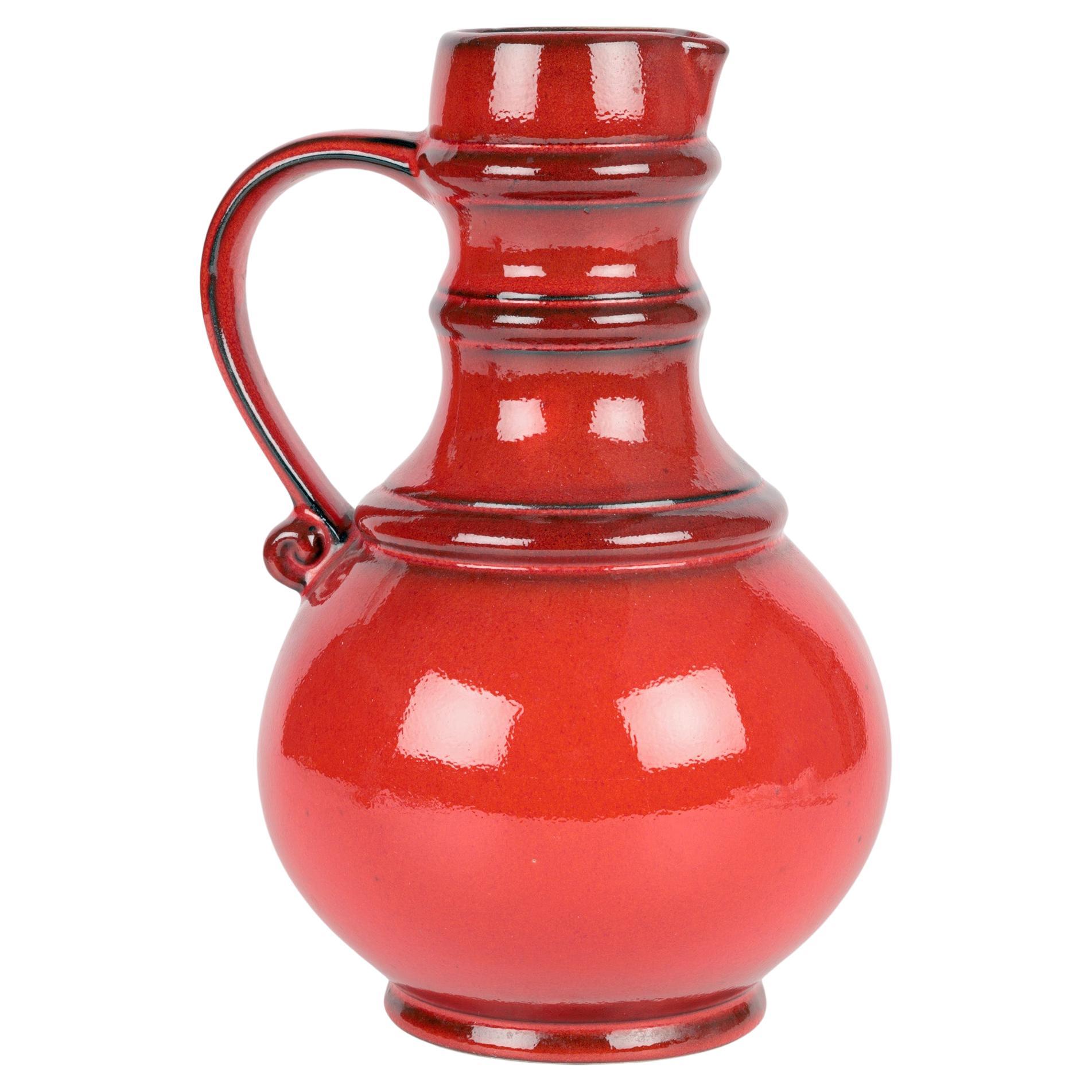 West German Mid-Century Pottery Red Lava Glazed Pitcher Vase For Sale