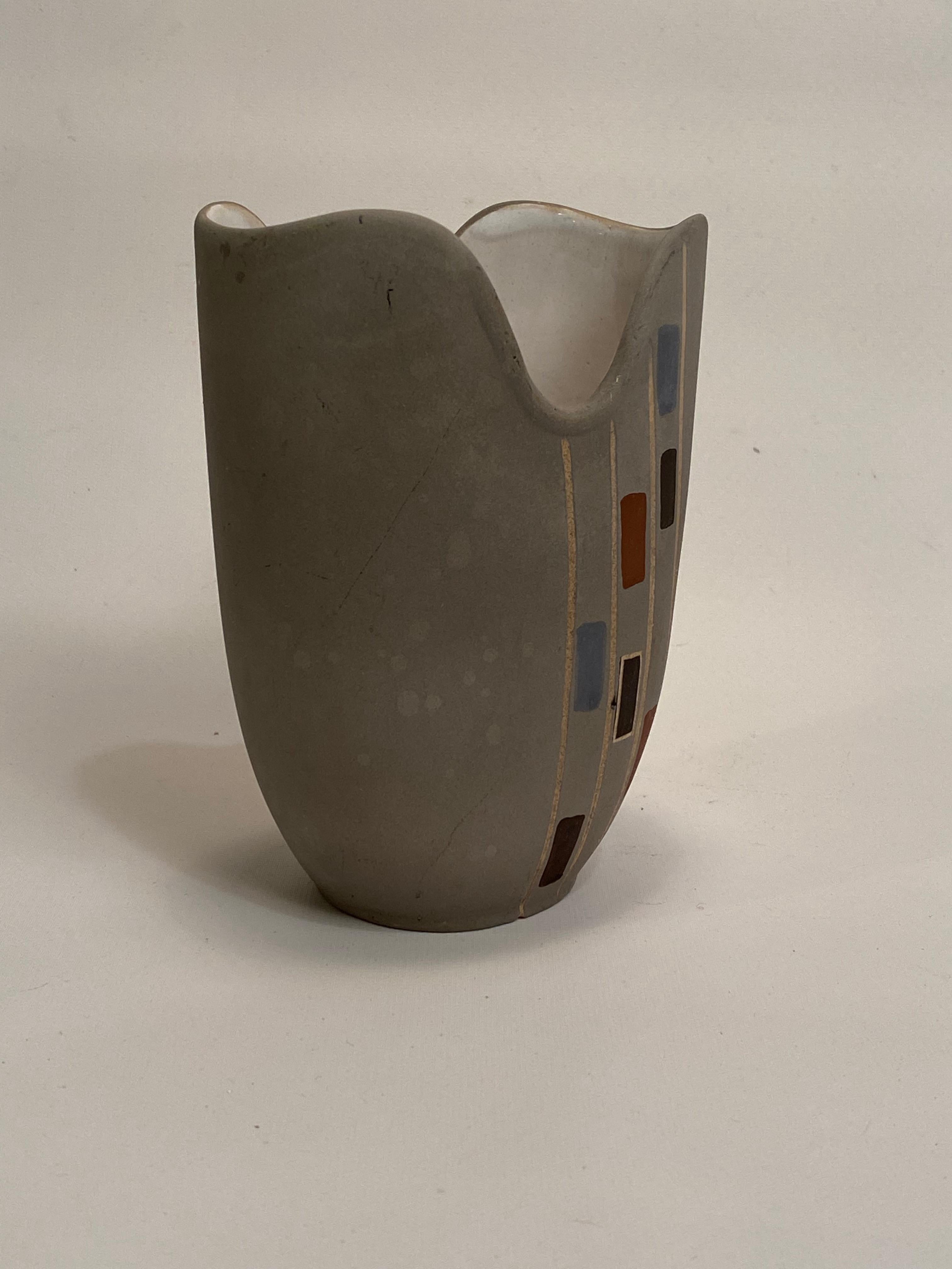 Light gray ceramic body decorated with a mosaic pattern. Nice lines and unusual form. Fully signed and numbered on the bottom. Circa 1950-60. Good condition with no visible chips, cracks, hairlines or restorations. Crazing to the white glazed