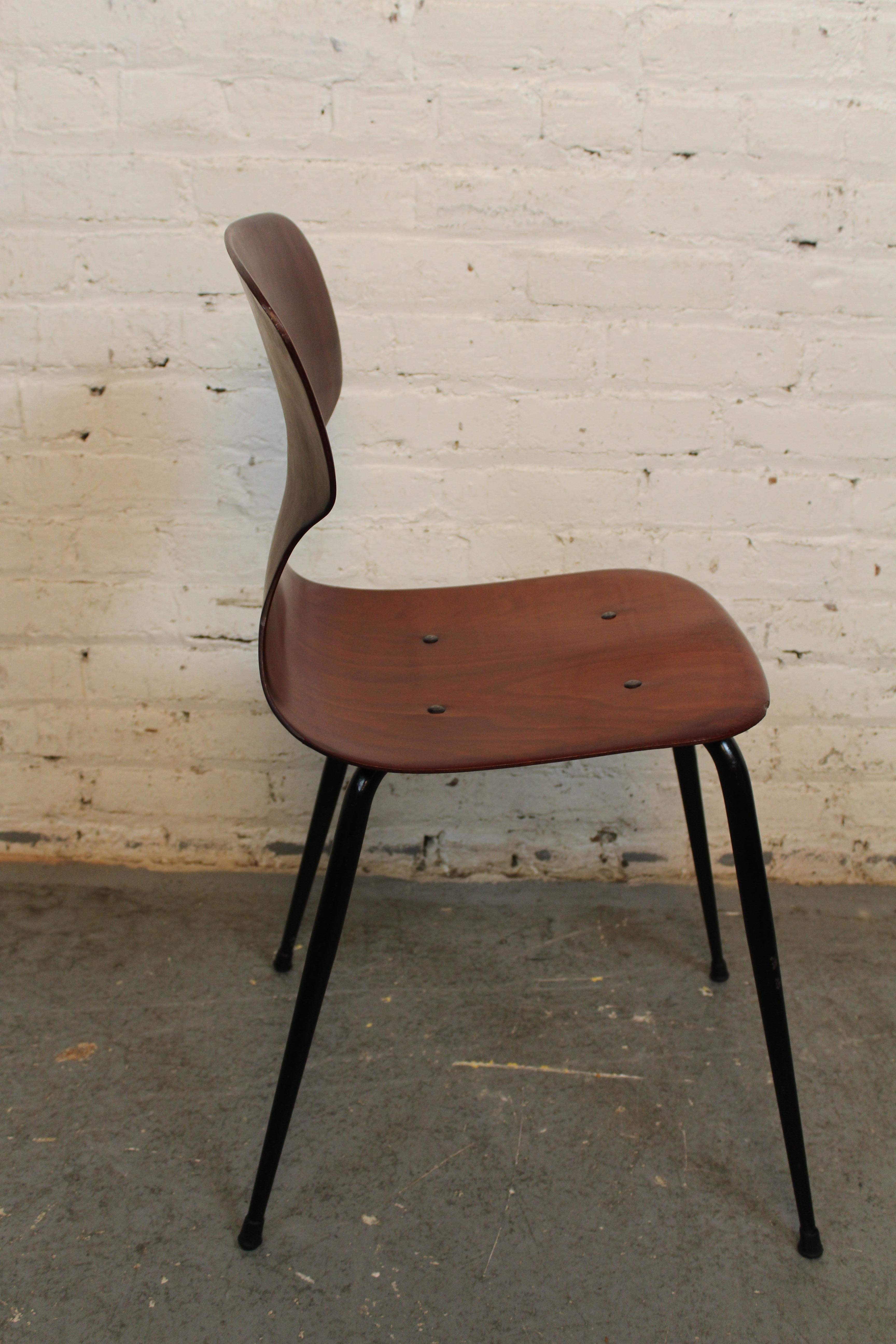 “Grin and chair it” with genuine vintage furniture! Conceived by Adam Stegner, a luminary of mid-century West German design, and produced by the prolific craftsmen of Pagholz Flötotto, this nimble student's chair features a rosy-stained plywood form
