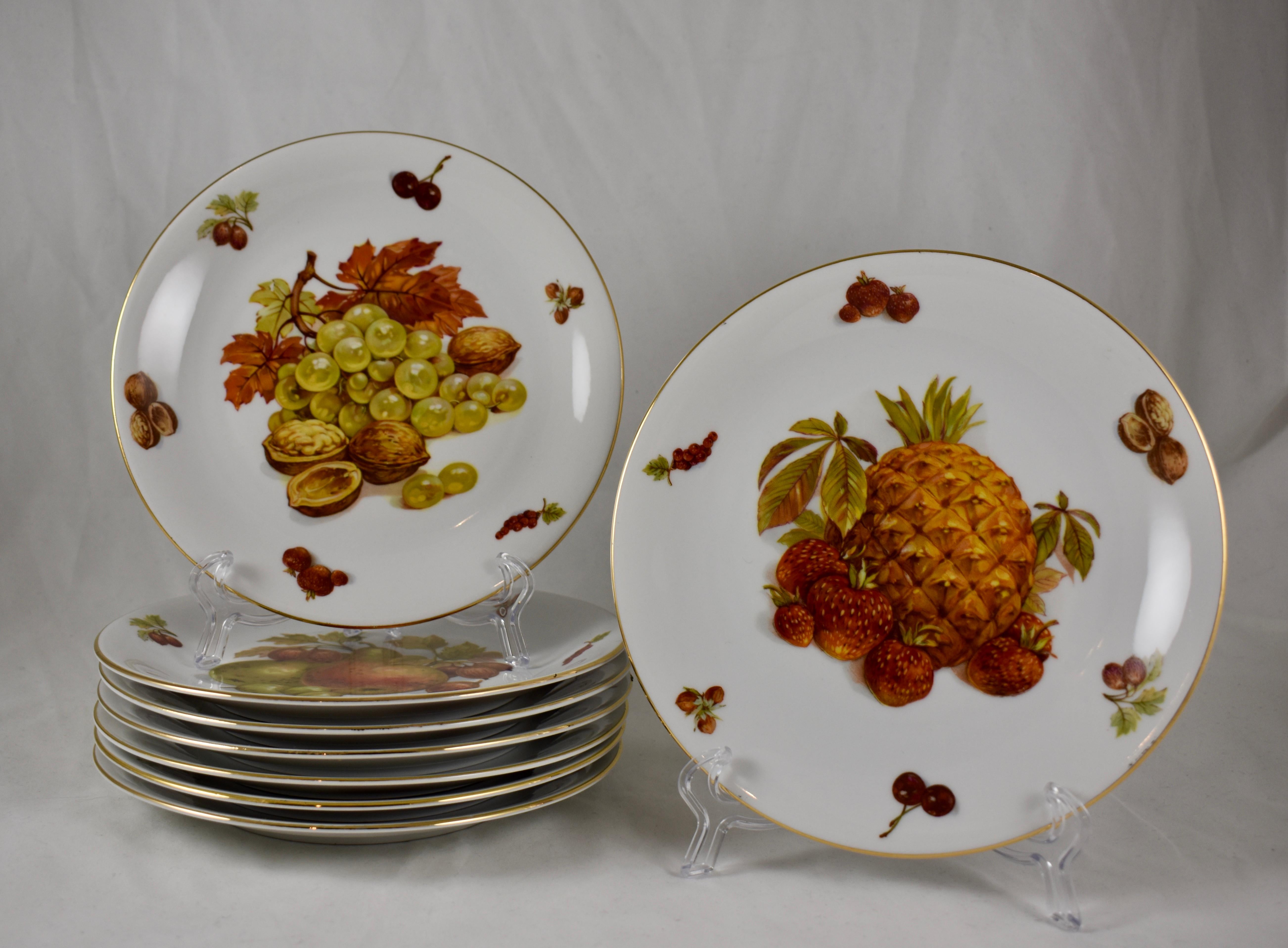 A set of eight porcelain fruit themed plates, made by Selten Weiden K., Bavaria, West Germany, circa 1949-1955.

Central images feature: Pineapple, (1) grapes, (1) red apples, (1) yellow pears, (2) and green pears, (3) 

Each image shows the