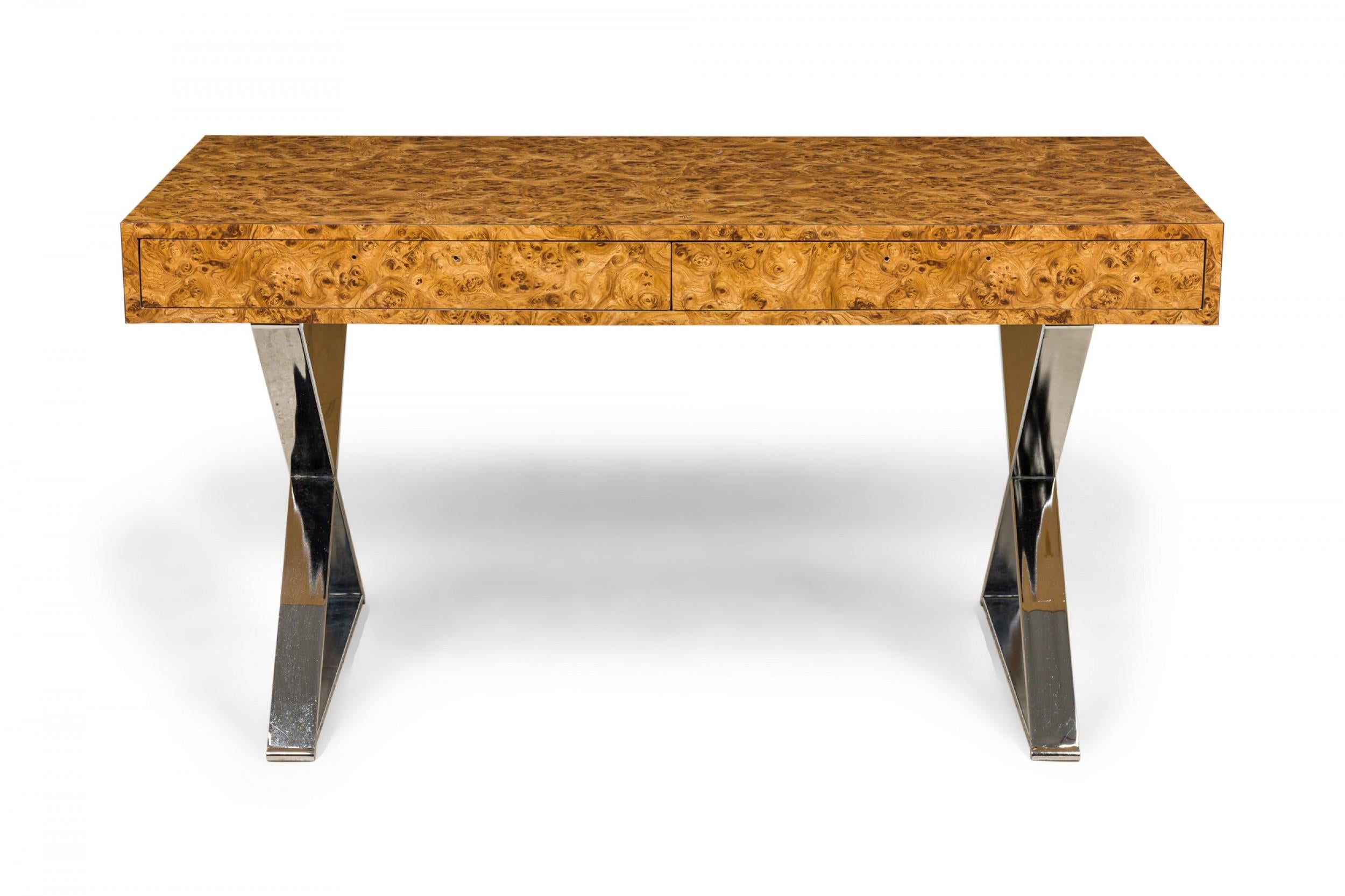 American Mid-Century rectangular campaign desk with a burl wood laminate top with two drawers, resting on two X-shaped silver metal legs.
