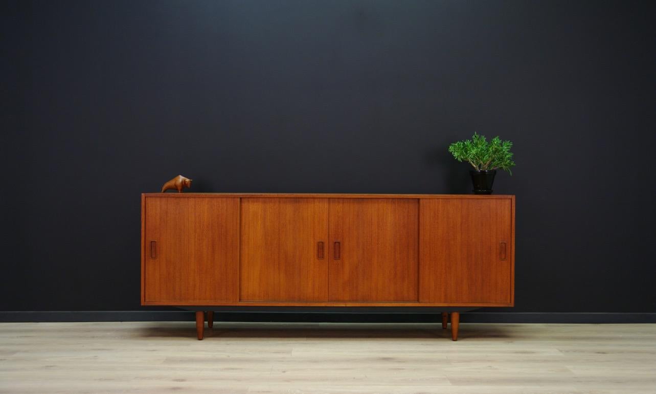 Fantastic sideboard, Danish minimalism from the 1960s-1970s, Classic form with sliding doors manufactured by Westergaard Møbelfabrik. Inside practical shelves and drawers. Sideboard veneered with teak. Preserved in good condition (small bruises and