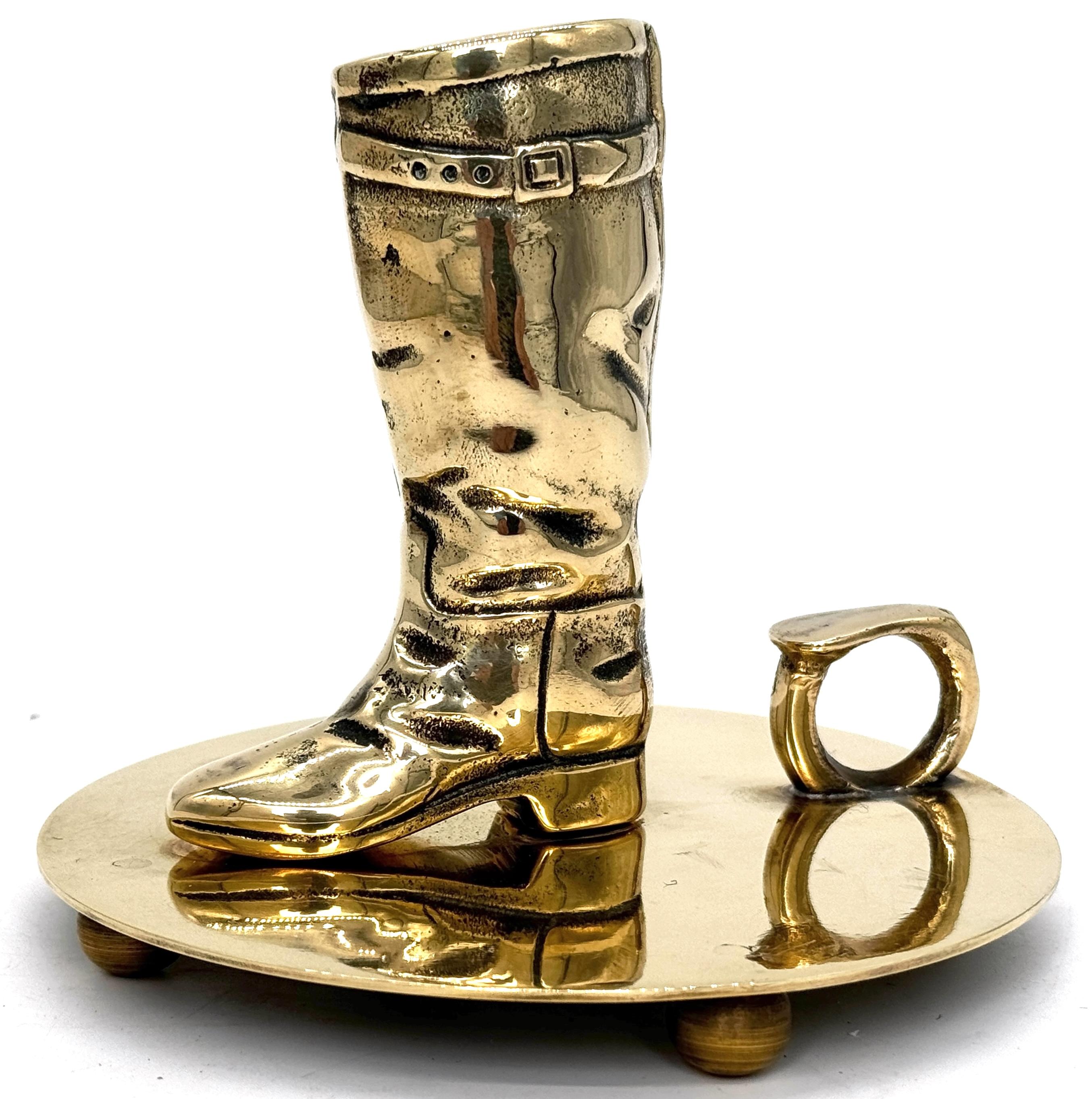 Western Boot Motif Brass Chamberstick by Ralph Lauren—Iconic Decorative Candle Holder

Add a touch of Western charm and luxury design to your interior with this Western Boot Motif Brass Chamberstick by Ralph Lauren. Measuring 5.5 inches high with a