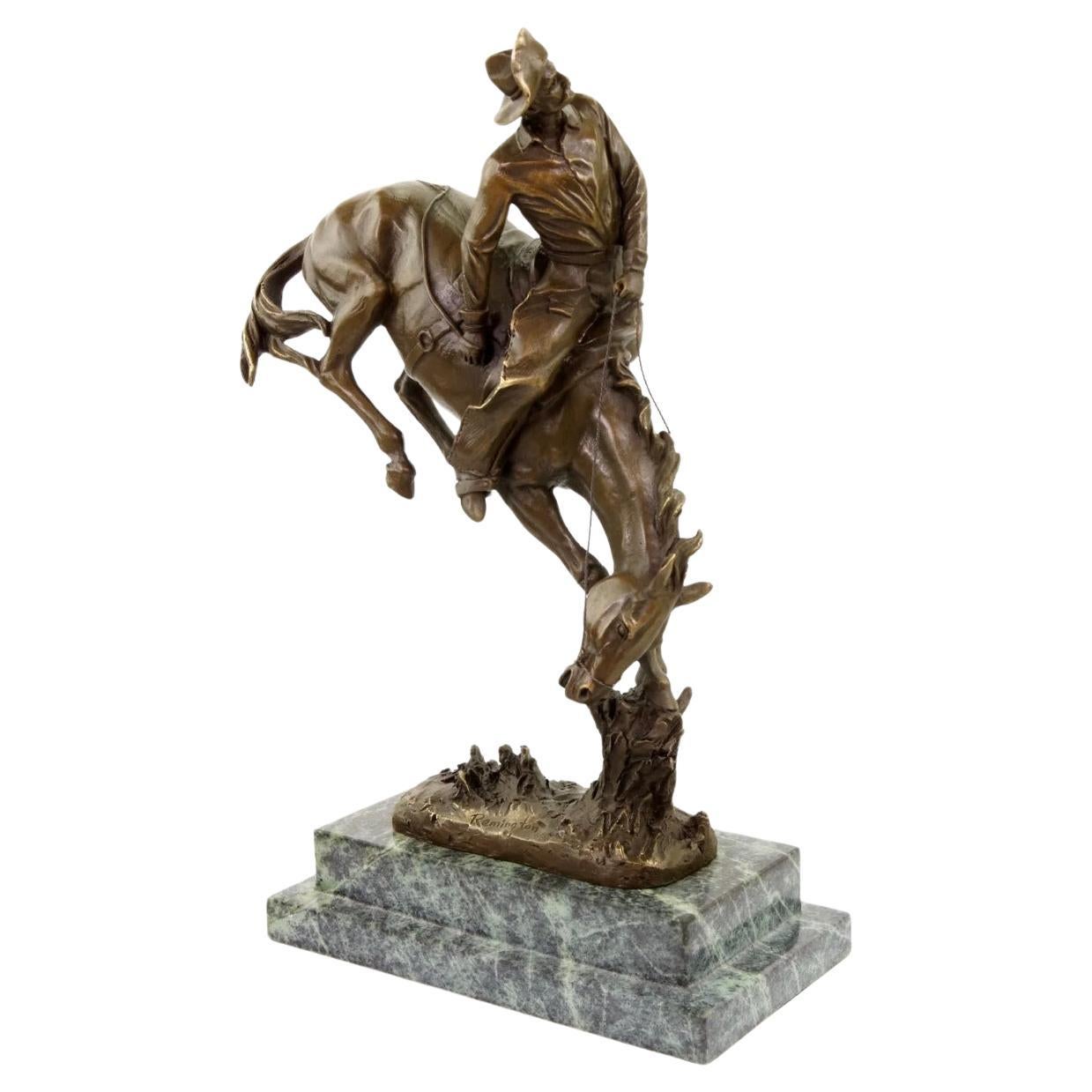 Sculpture western en bronze représentant un cow-boy sur un cheval, 20e siècle