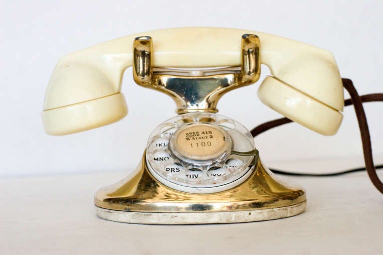 The Western electric was the first widely distributed phone which adopted the use of a single handset rather than a separate transmitter and receiver. This D model comes plated in 12-karat gold and features a white Bakelite headset. 

This phone