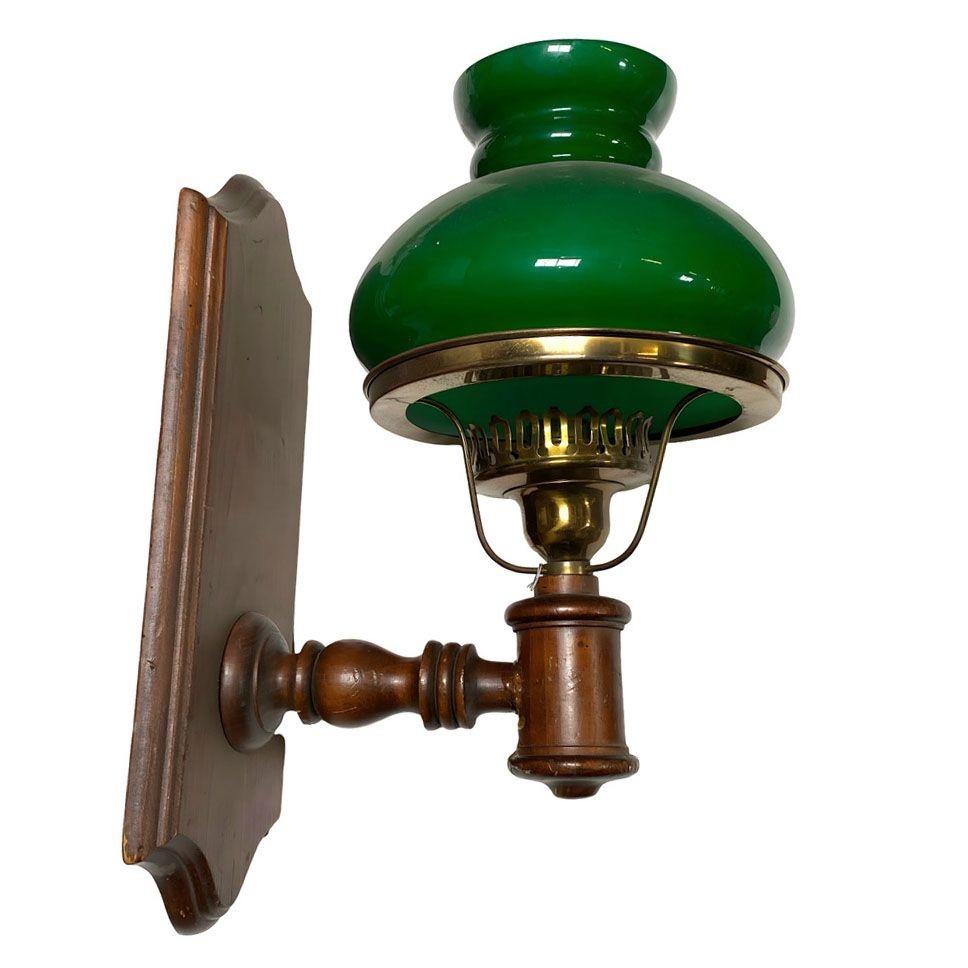 Pair of Mid-century Western style Green Bankers Electric Sconce with Shades. Each Lamp is fabricated in the style of old oil lamps from the late Victorian Western era. Each sconce is adorned with a green-cased banker-style globe which rest on a