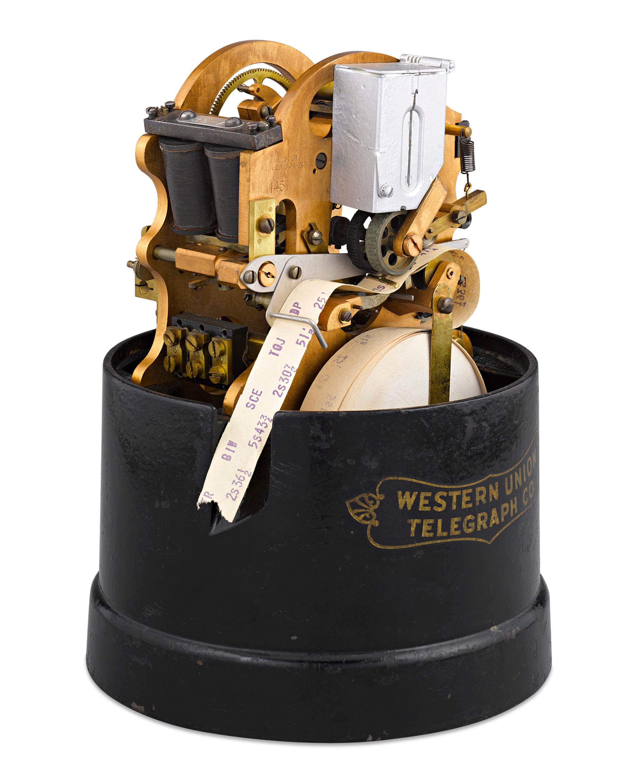 The symbol of Wall Street, this innovative self-winding stock ticker telegraph is a celebration of American financial and technological advancement. Manufactured at the factory of legendary inventor Thomas Edison, this brass and steel mechanism