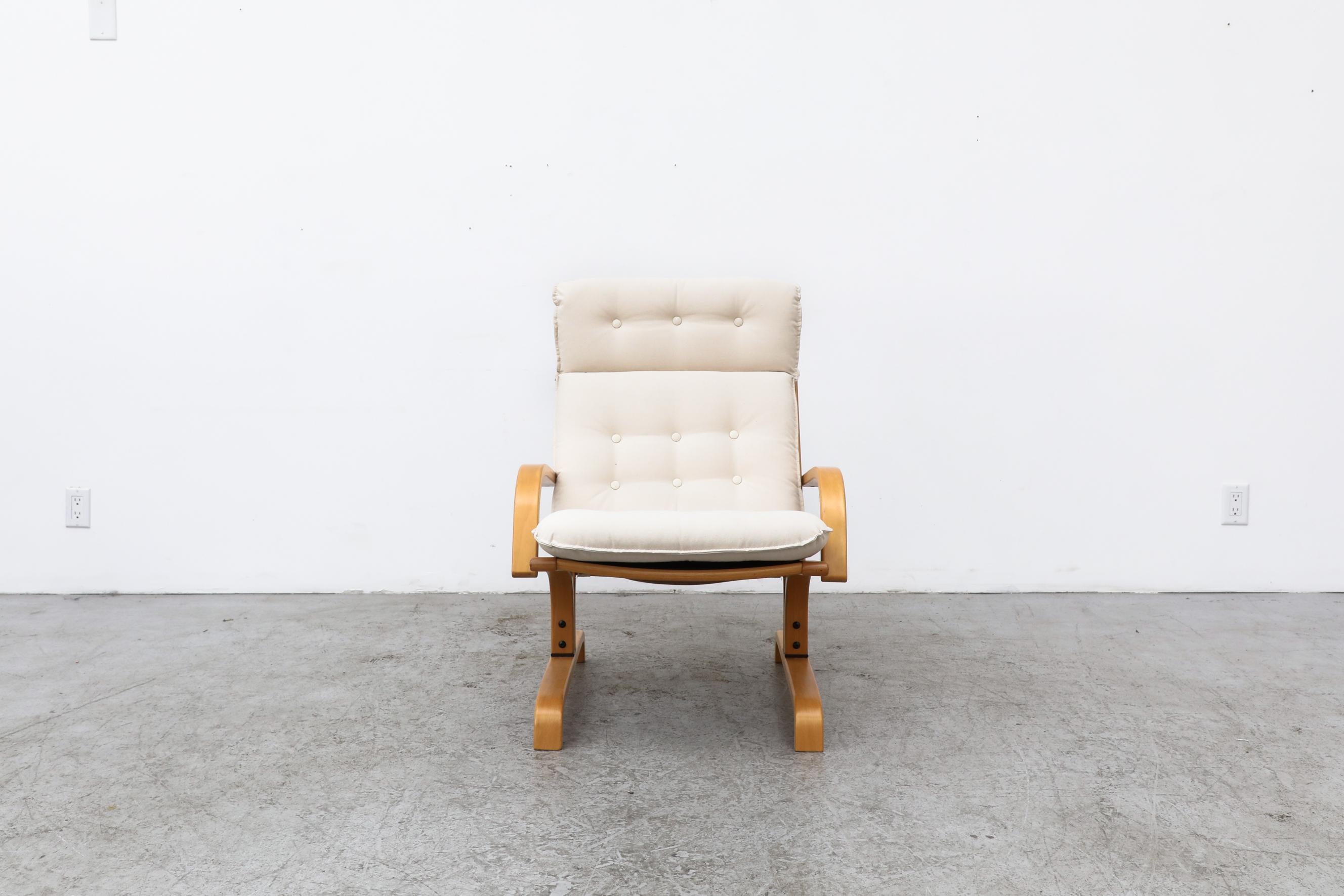 Westnofa high back lounge chair with a cantilevered bentwood frame and newly upholstered natural canvas cushions. In original condition with normal wear to the frame, consistent with its age and use. Other Westnofa chairs are available and listed