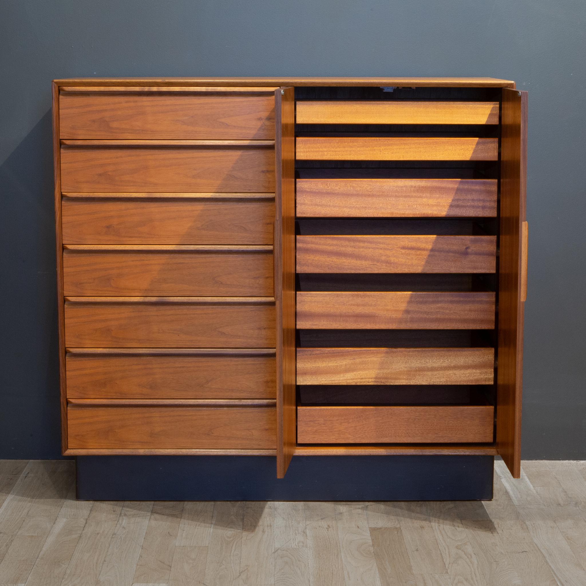 About

A Mahogany and Teak gentleman's chest by Westnofa, Norway. This statement chest has rich wood grain throughout the entire piece, sharply, curved drawer pulls and dovetail joints. A rare piece with fourteen drawers rather than adjustable