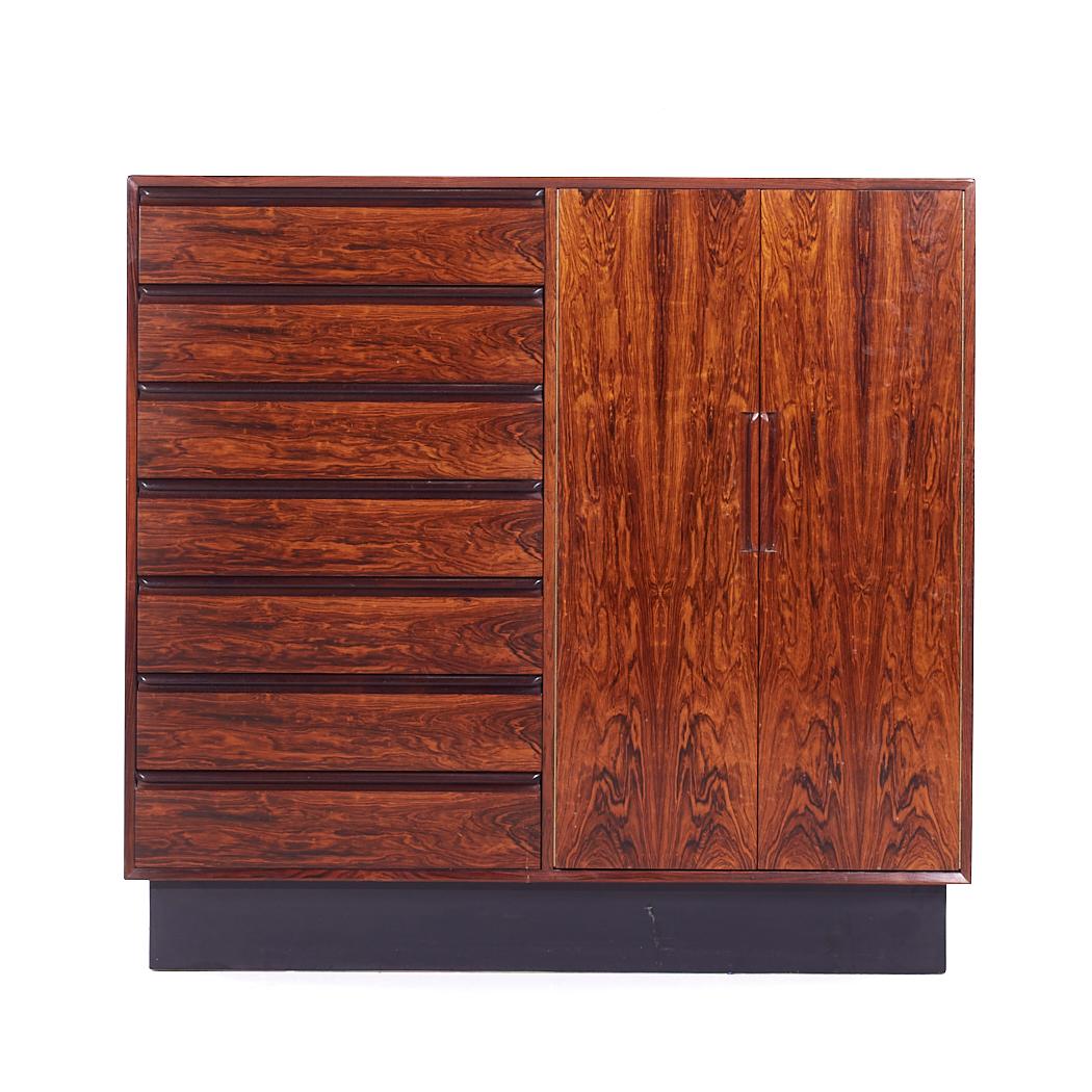 Westnofa Mid Century Danish Rosewood 14 Drawer Armoire Gentleman's Chest Highboy Dresser

This highboy measures: 48 wide x 18 deep x 45.5 inches high

All pieces of furniture can be had in what we call restored vintage condition. That means the