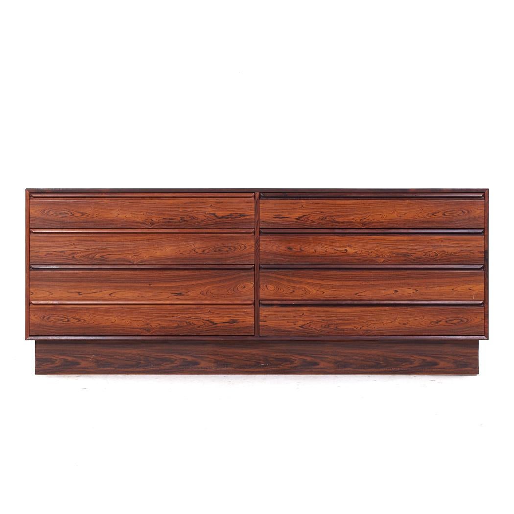 Westnofa Mid Century Danish Rosewood 8 Drawer Lowboy Dresser

This lowboy measures: 71.5 wide x 18 deep x 29 inches high

All pieces of furniture can be had in what we call restored vintage condition. That means the piece is restored upon purchase