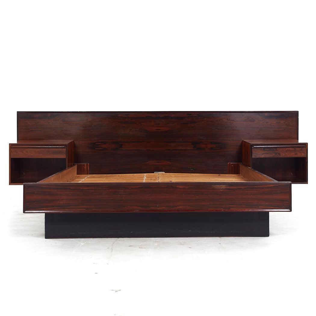 Westnofa Mid Century Danish Rosewood Queen Platform Bed with Nightstands

The headboard measures: 105.25 wide x 81 deep x 33 inches high
The bed frame measures: 62.75 wide x 81 deep x 21.25 inches high

All pieces of furniture can be had in what we