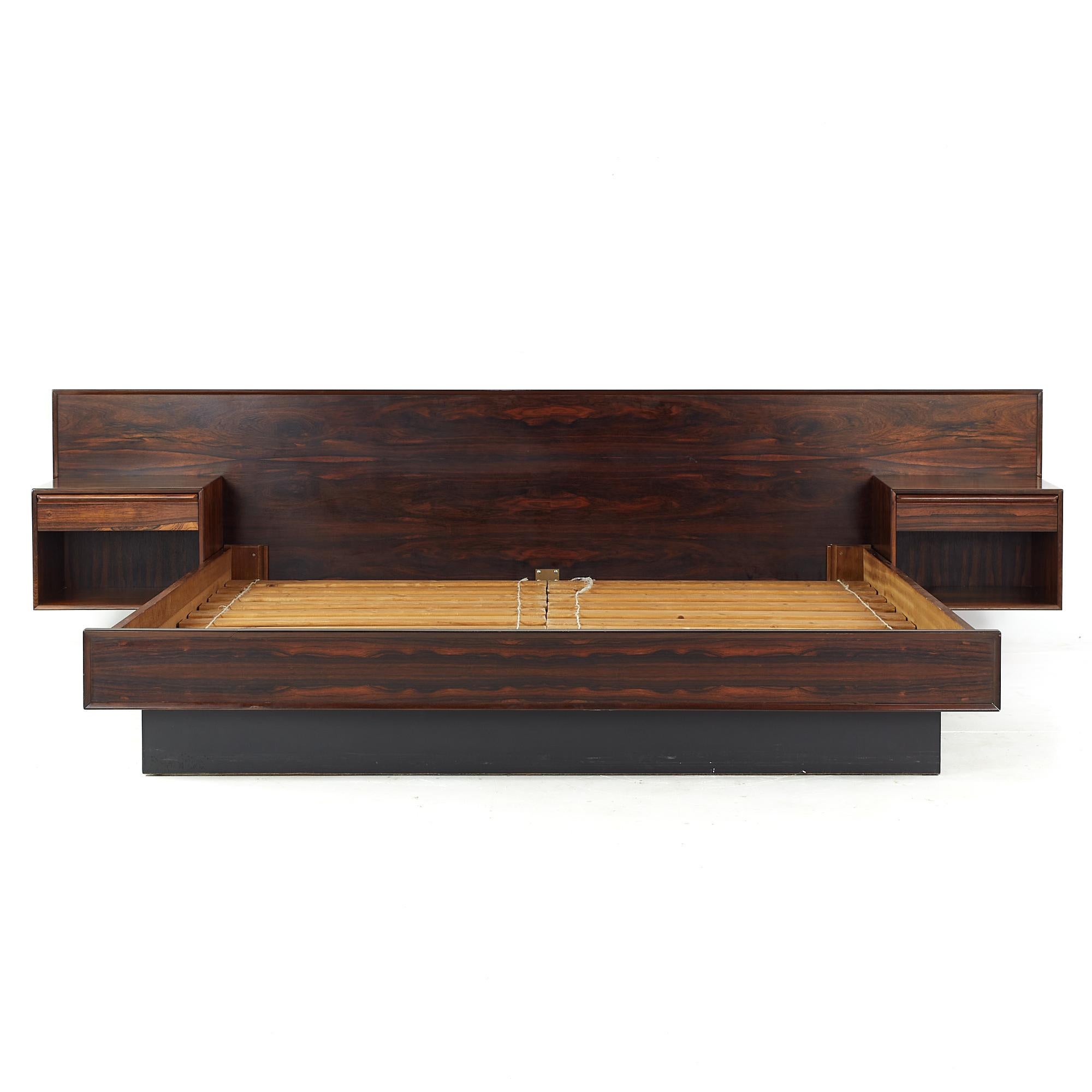 Westnofa mid century king rosewood platform bed with built in nightstands

This platform bed measures: 123.25 wide x 83 deep x 32.75 inches high

All pieces of furniture can be had in what we call restored vintage condition. That means the piece
