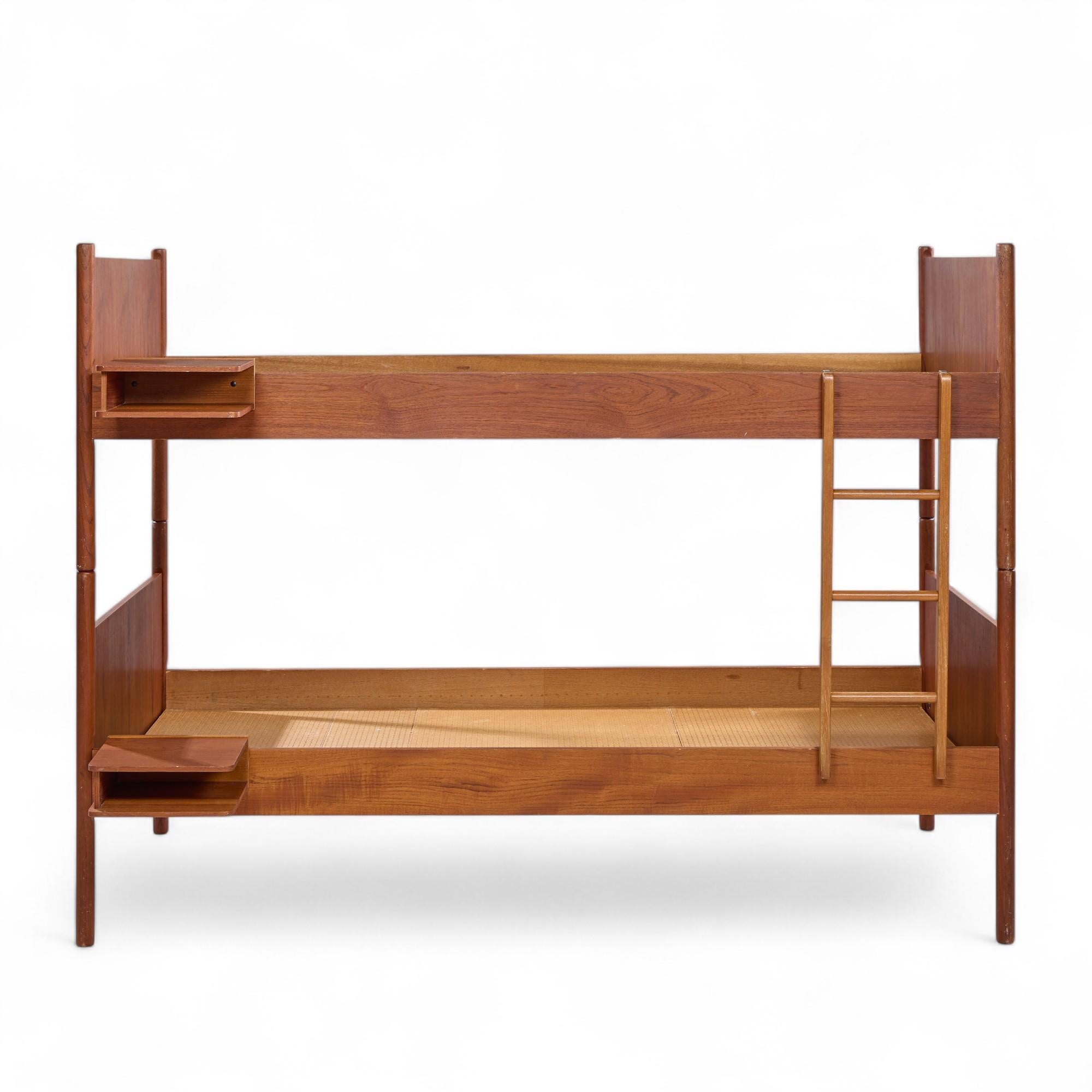 Westnofa Mid Century Norwegian Teak Bunk Bed

This bunk bed measures: 41.25 wide x 77.75 deep x 58 inches high
The nightstand attachment measures 10.75 inches wide

All pieces of furniture can be had in what we call restored vintage condition. That