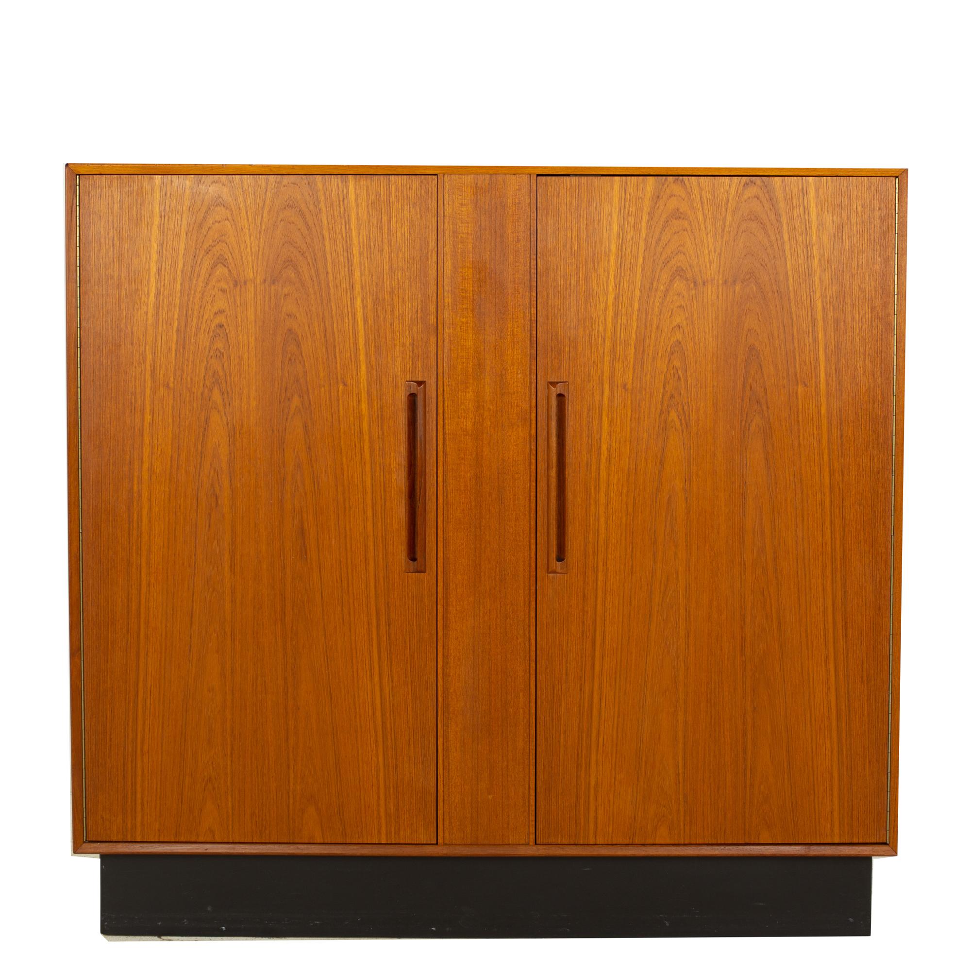 Westnofa mid century teak gentleman's chest armoire
Armoire measures: 48 wide x 18 deep x 45.5 inches high

?All pieces of furniture can be had in what we call restored vintage condition. That means the piece is restored upon purchase so it’s