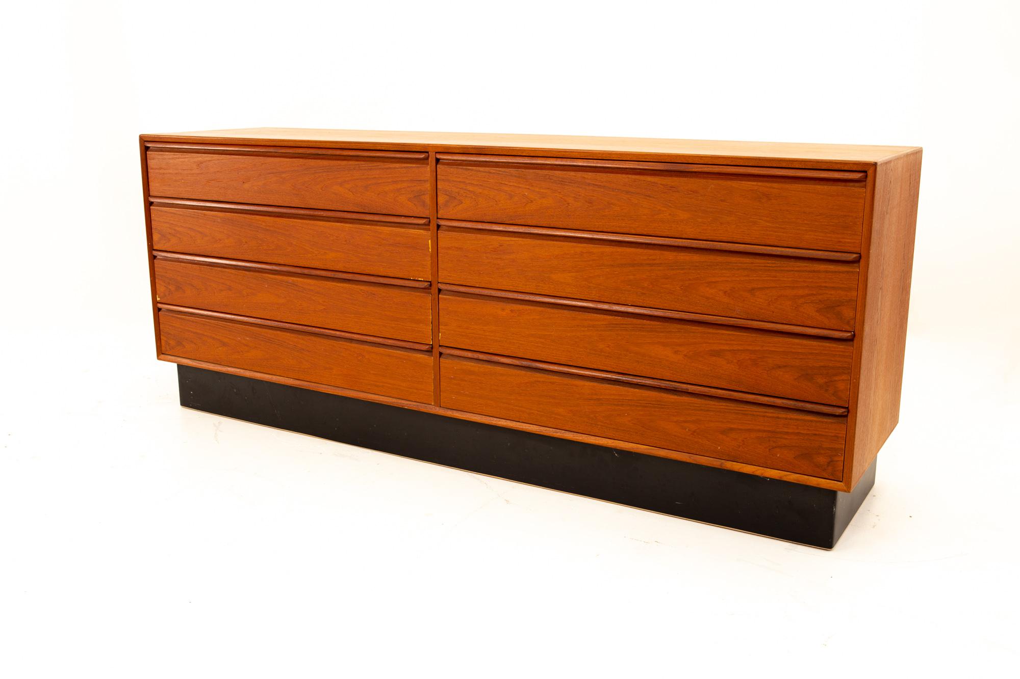 Westnofa mid century teak plinth base 8 drawer lowboy dresser
Dresser measures: 71.5 wide x 18 deep x 29 high

All pieces of furniture can be had in what we call restored vintage condition. That means the piece is restored upon purchase so it’s