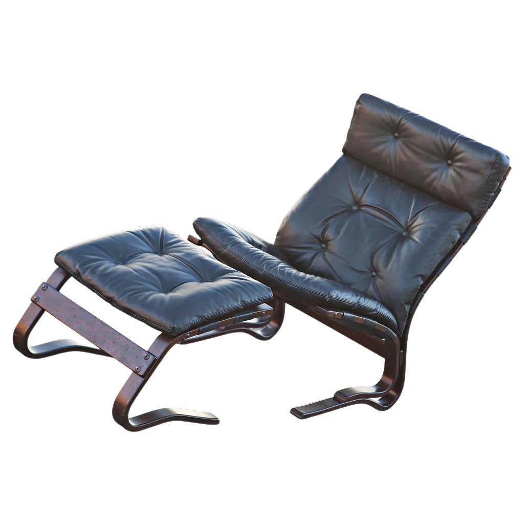 Westnofa Scandinavian rosewood lounge chair & ottoman by Ingmar Relling

A Mid-Century Modern lounge chair and ottoman made in Norway by Westnofa. Rosewood bentwood frames with black leather cushions. 

It's nice early example of Ingmar