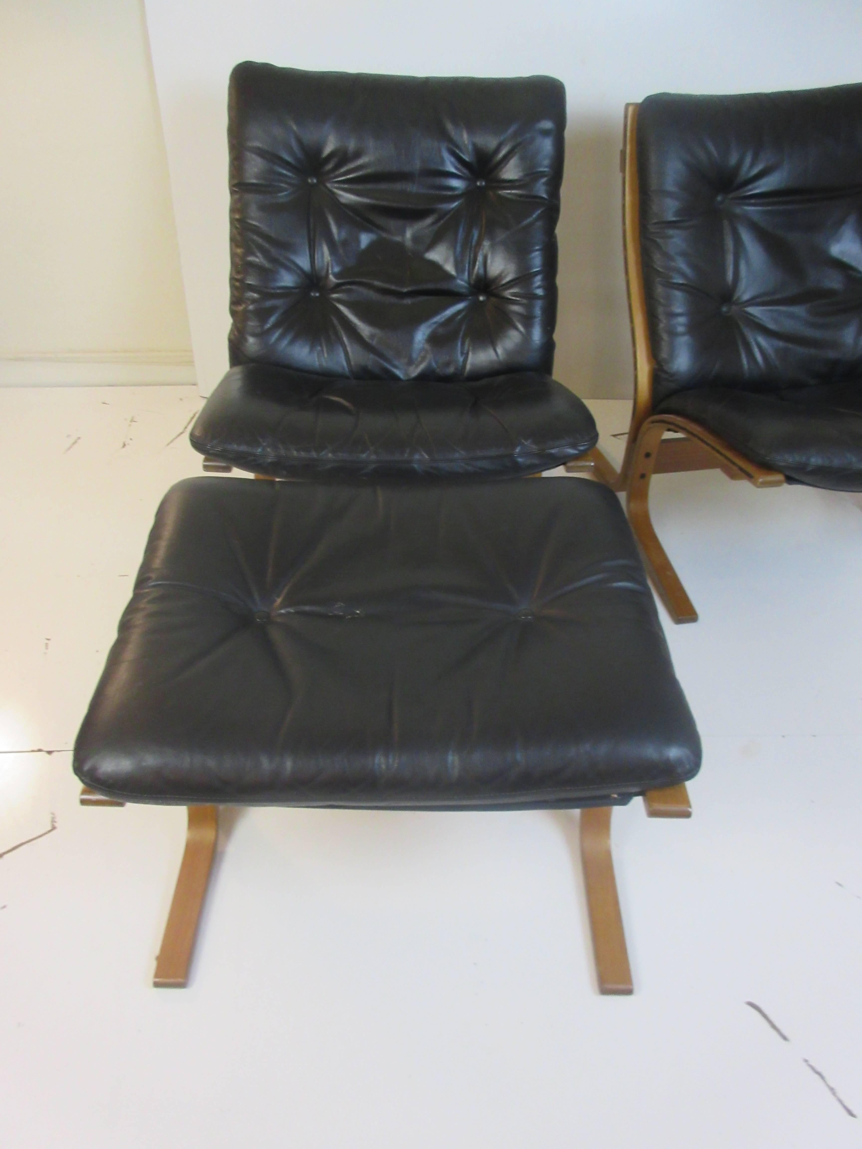 Westnofa Siesta chair and ottoman in leather by Ingmar Relling on bent wood frames made in Norway. Loose cushions are supported by canvas slings tied to frames via grommets. Measurements of the chair alone are 26 wide x 30 deep x 32 high and seat is