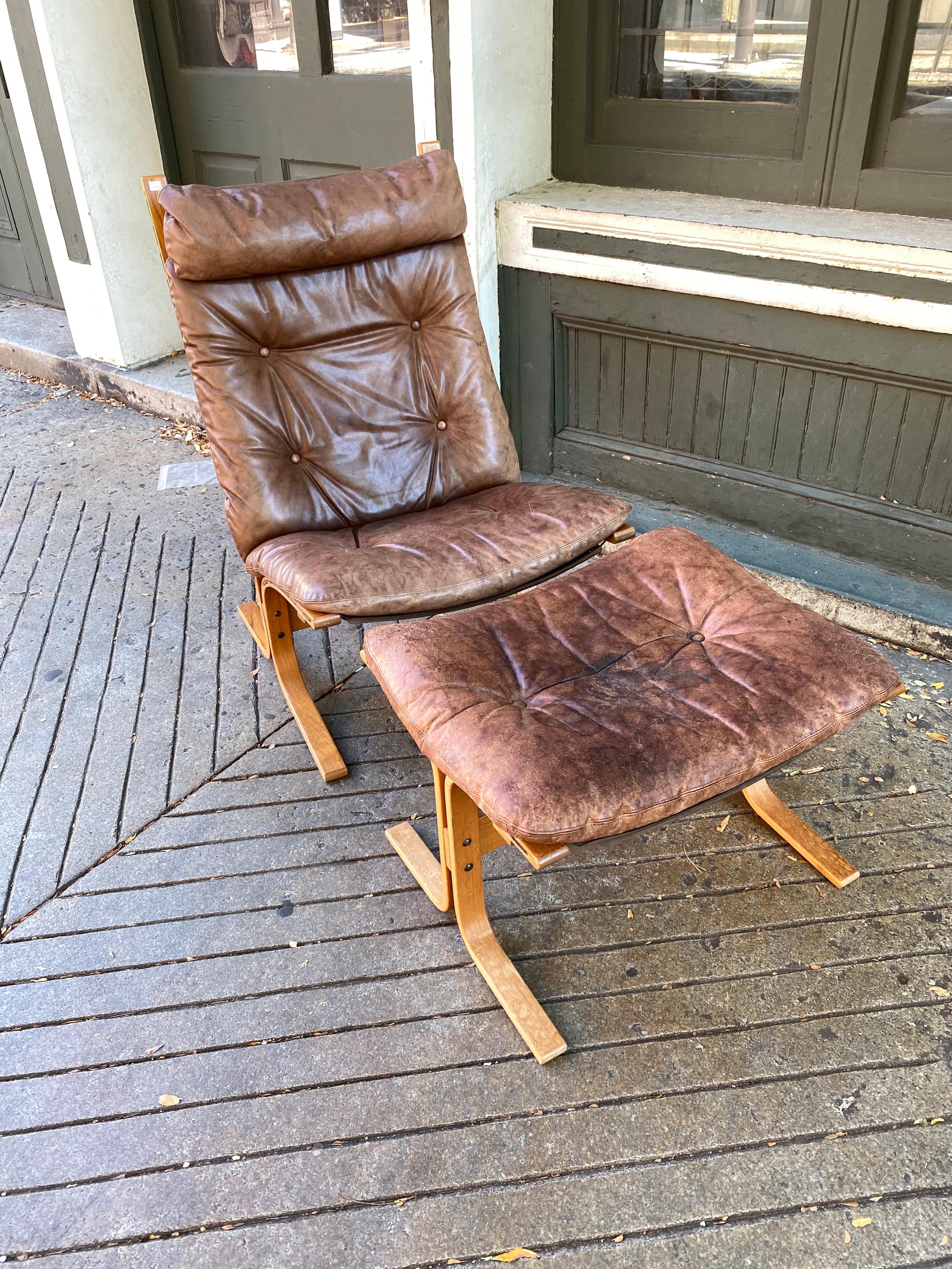 Westnofa Siesta lounge chair and ottoman designed by Ingmar Relling and made in Norway. Very comfortable set! Leather is showing overall wear and staining, mostly on the ottoman. Leather is Solid but you can see tons of Patina! Canvas and string in