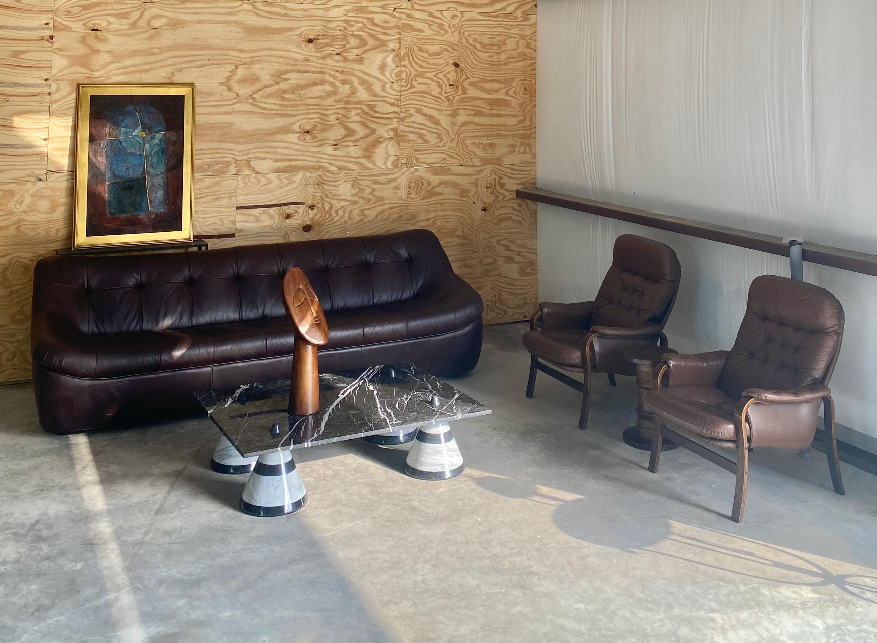 Pair of tufted leather bentwood chairs from a recent container shipment from Denmark. A comfortable way to incorporate the beauty and fine craftsmanship of bentwood with the timeless elegance of patina-rich leather. These stylish lounge chairs with